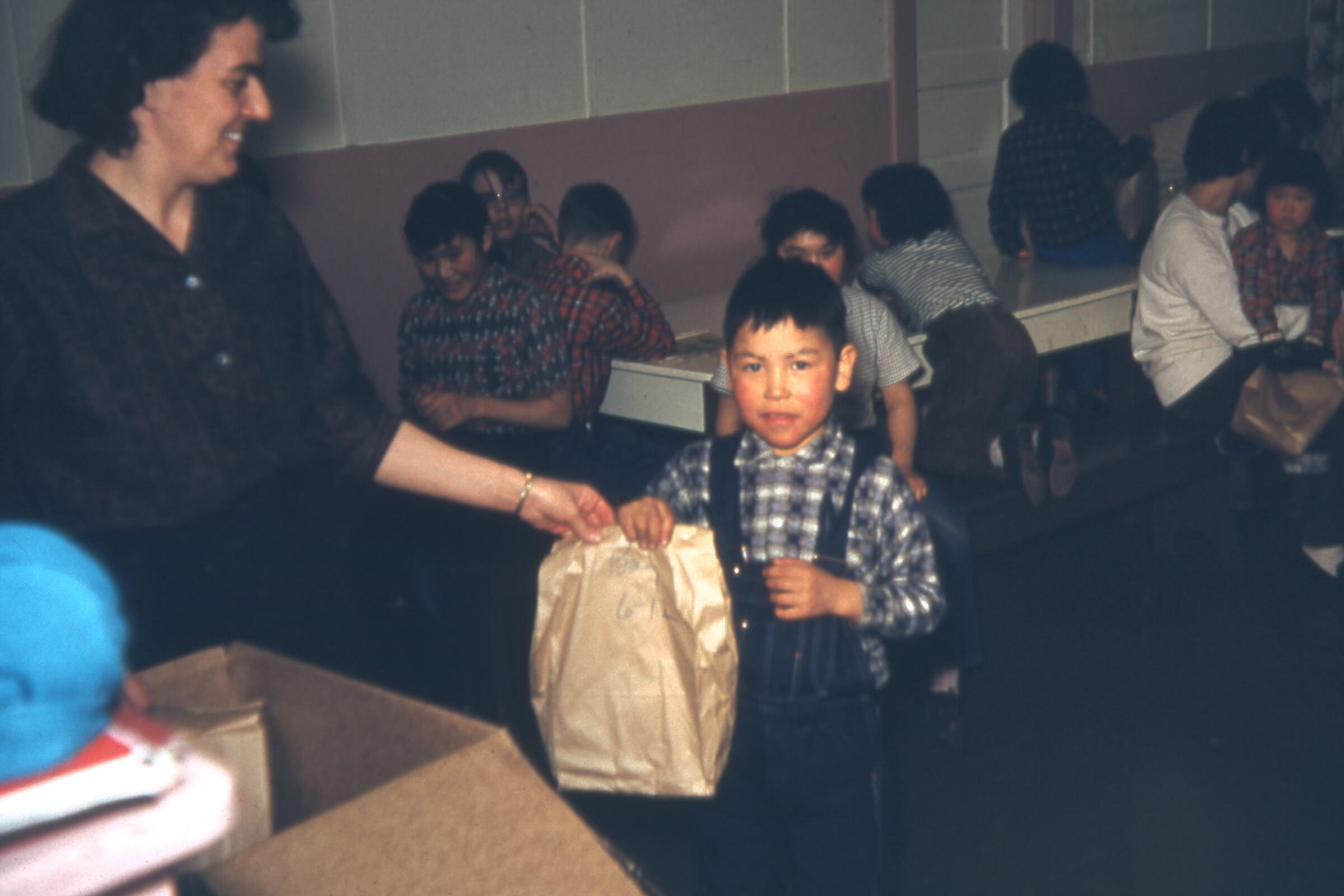 1962 Pauline handing out bags.jpg