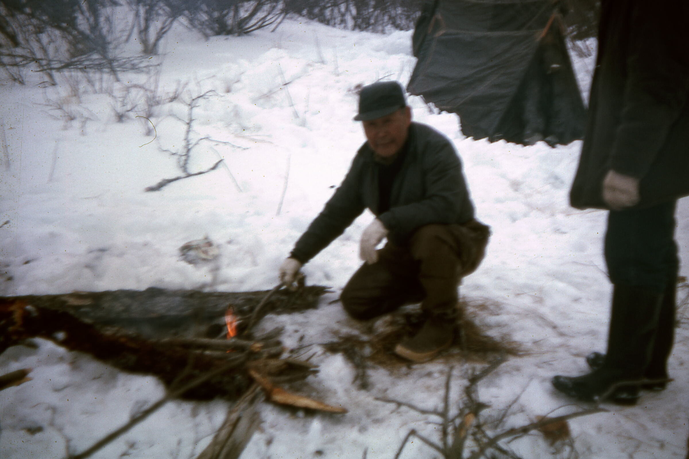 1963 Alec Nicori helping Boy Scouts start camp fire.jpg