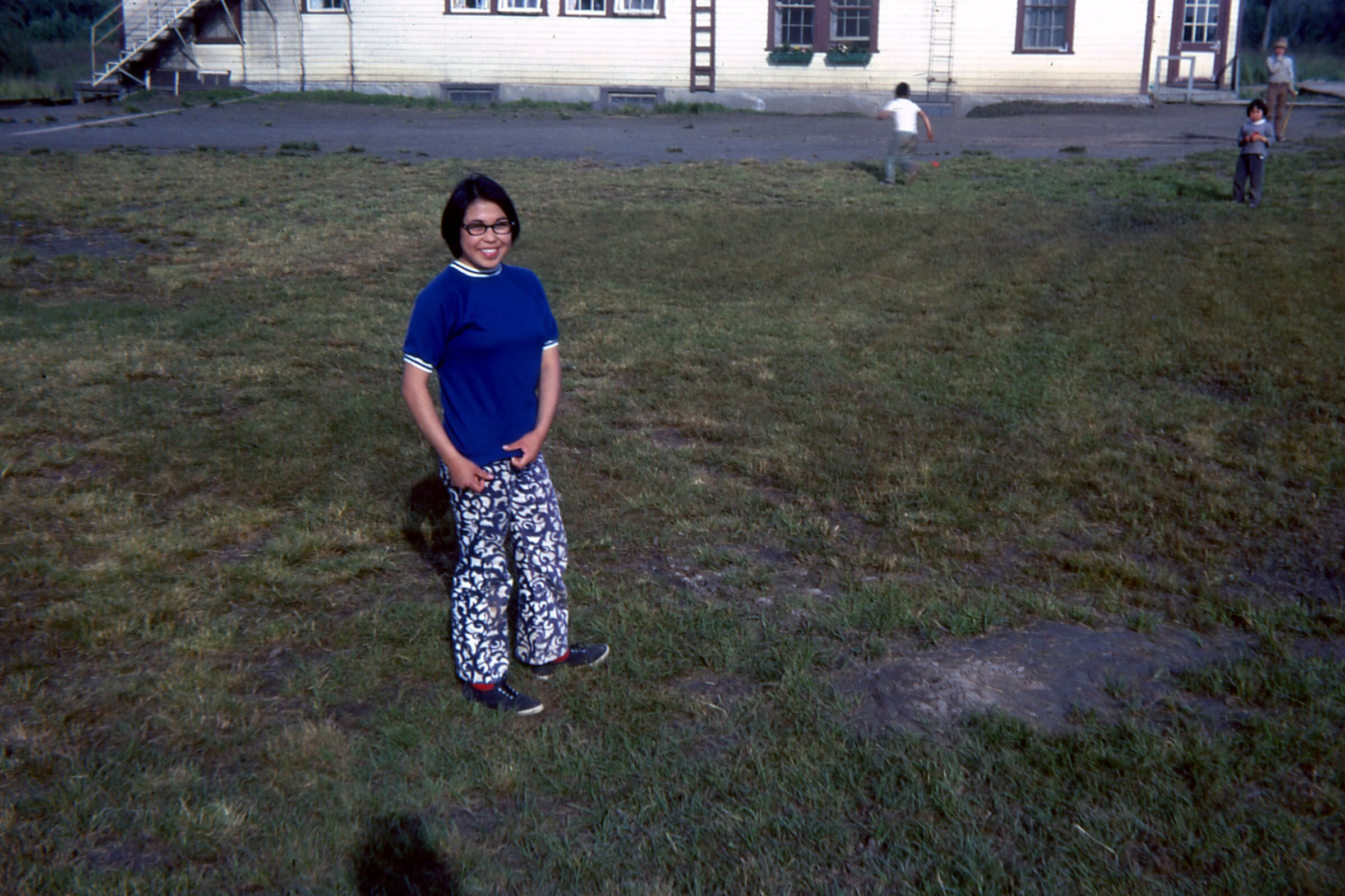 1971 Girl in yard by Girls Dorm.jpg