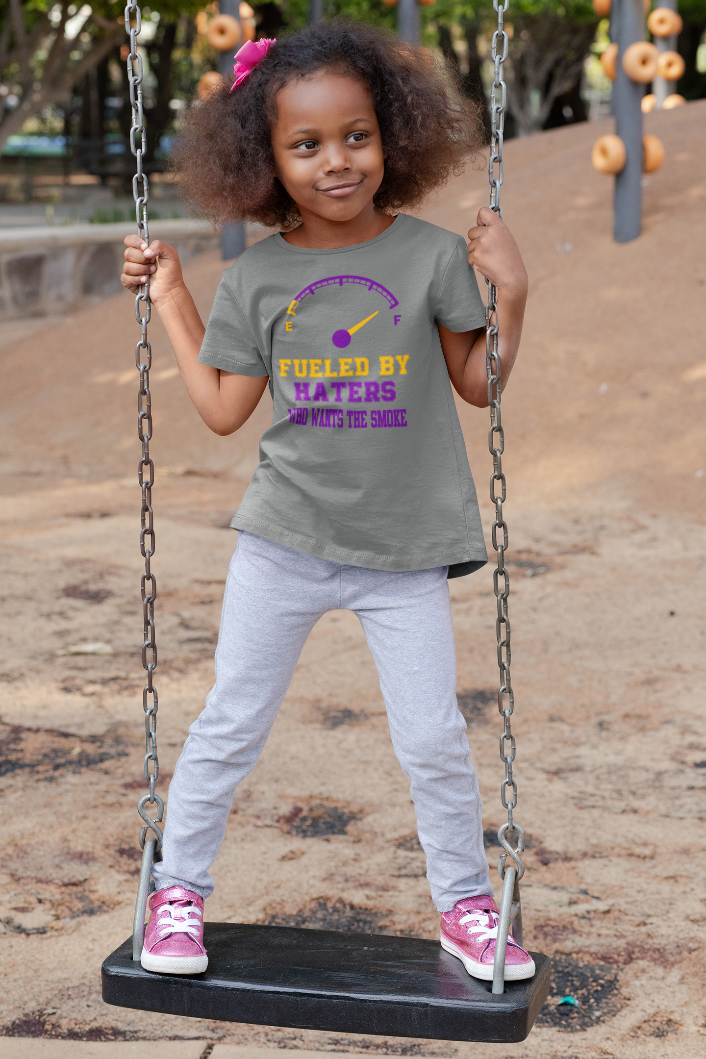 t-shirt-mockup-of-a-playful-girl-standing-on-a-swing-32179 (1).png