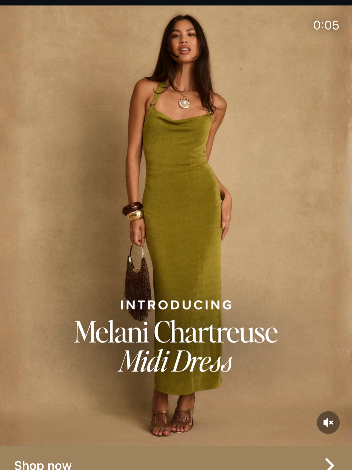 A woman in a green midi dress with accessories, holding a small handbag, standing against a beige background, promoting Melani Chartreuse Midi Dress.