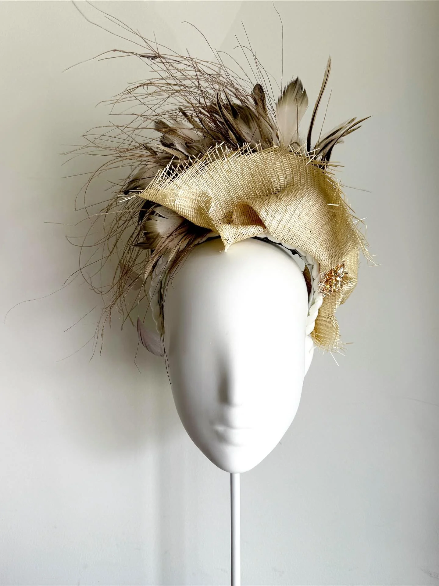 Beige is back &amp; here to stay&hellip;&hellip;&hellip;&hellip;&hellip;&hellip;&hellip; Introducing our latest head couture piece, sculpted natural state with distressed edges, combined with a spray of mixed feathers &amp; crustal brooch, she&rsquo;