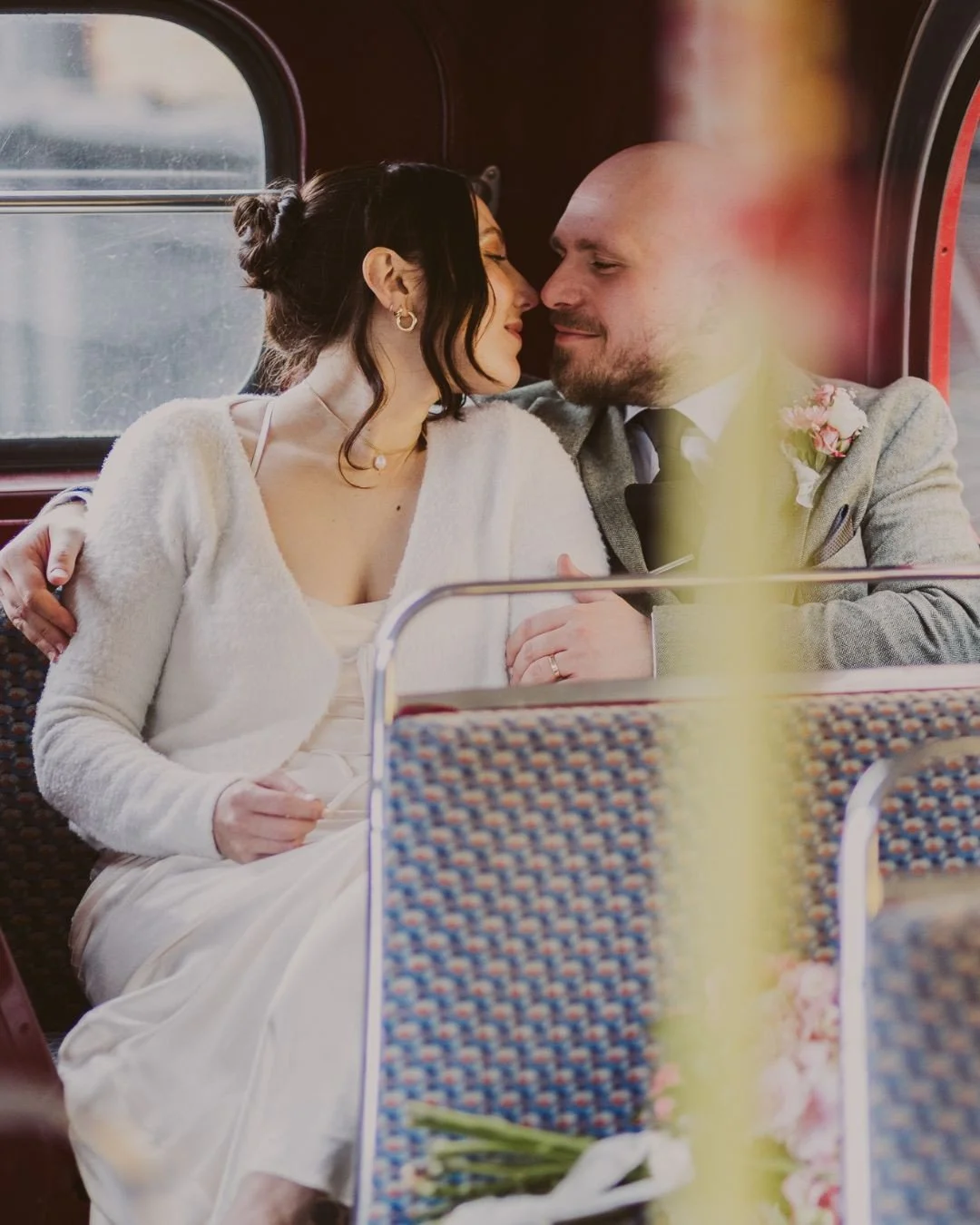 One of my favourite bits of a wedding day: stealing a few minutes away from the go-go-go to just be together (and grab a few portraits while we're at it). This was K + D snuggled up on the back seat of their wedding Routemaster when it was too wet to