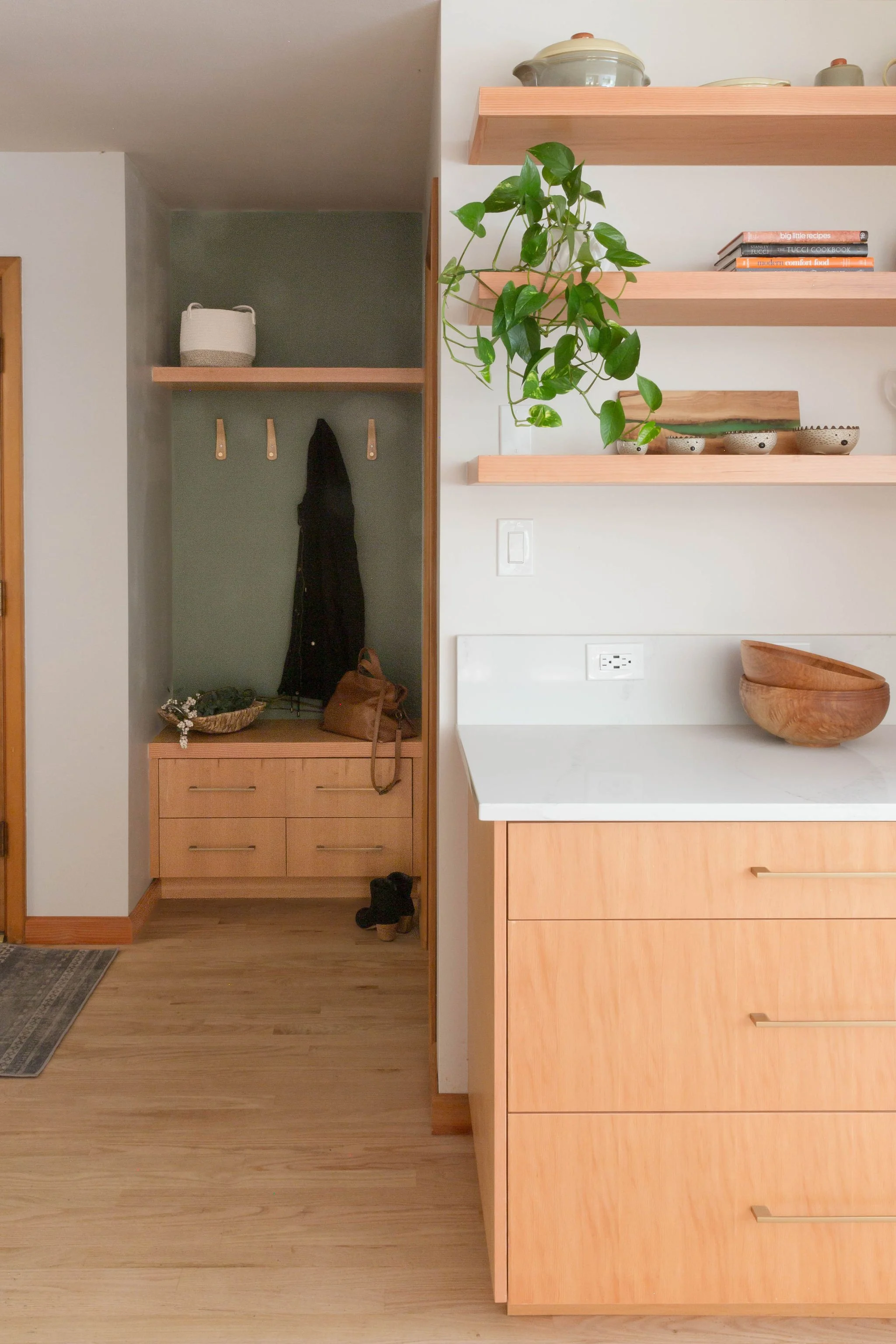 Custom kitchen remodel showcasing wood cabinetry, an open layout, island seating, and a bright, inviting design.