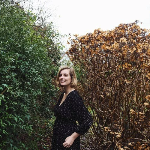 Woman-in-black-dress-in-bushes.jpg