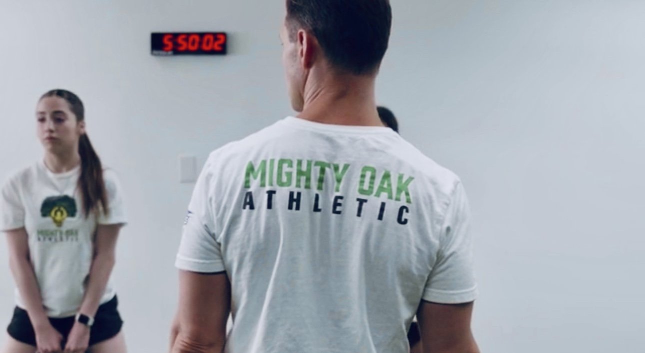 Coach Mike Ockrim (CSCS) coaching a high school dance team at Mighty Oak Athletic — team strength and agility training in DuPage County