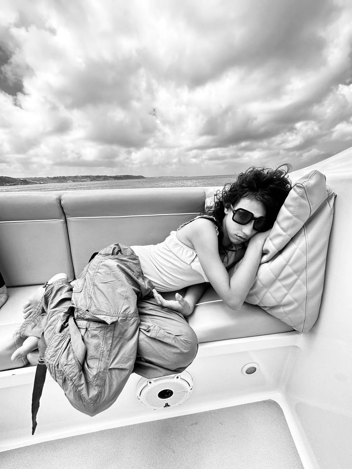 Guest relaxing on board a GoodLiving Charters private boat in Anguilla