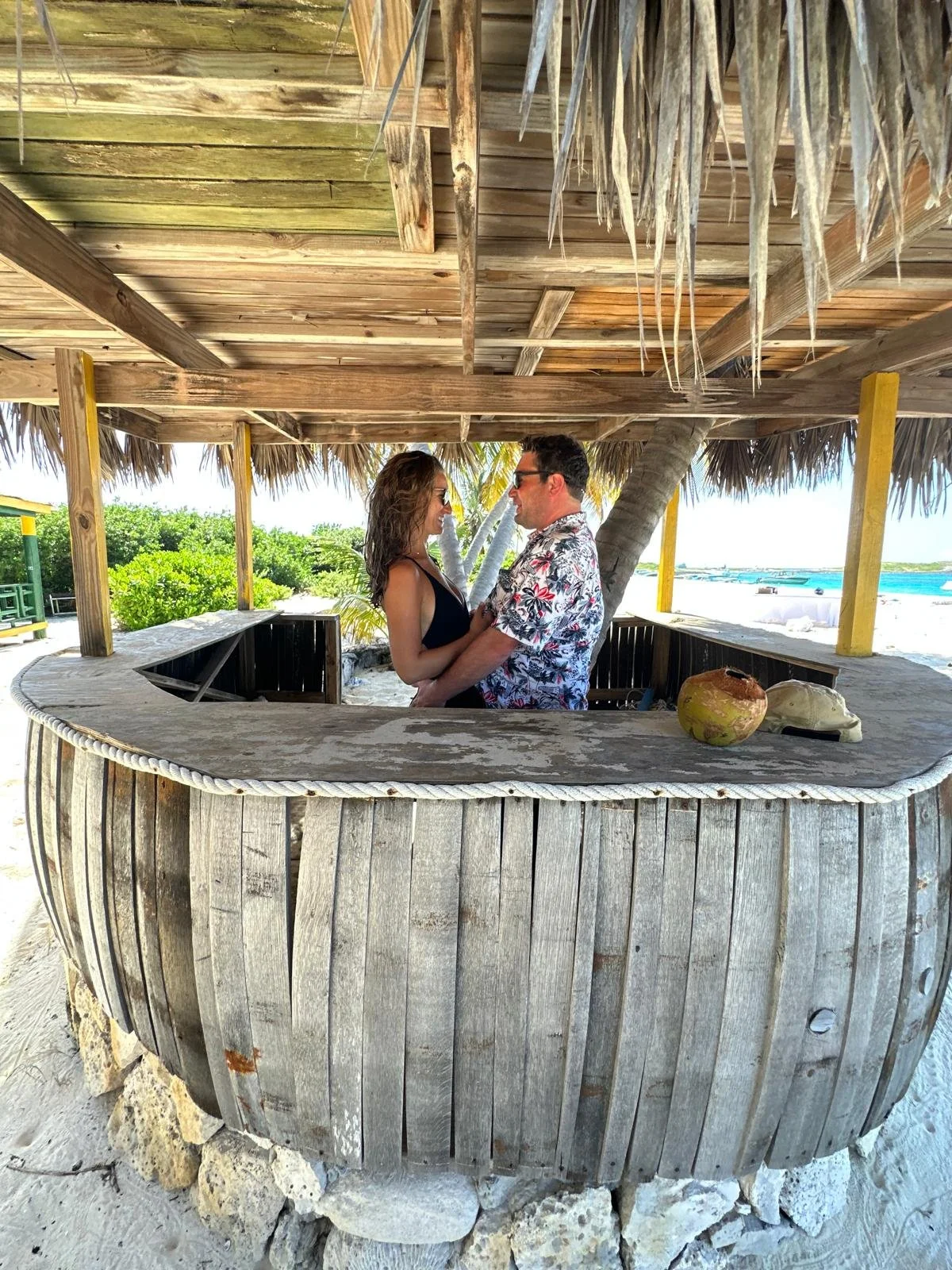 Couple enjoying time together at a rustic beach bar in Anguilla