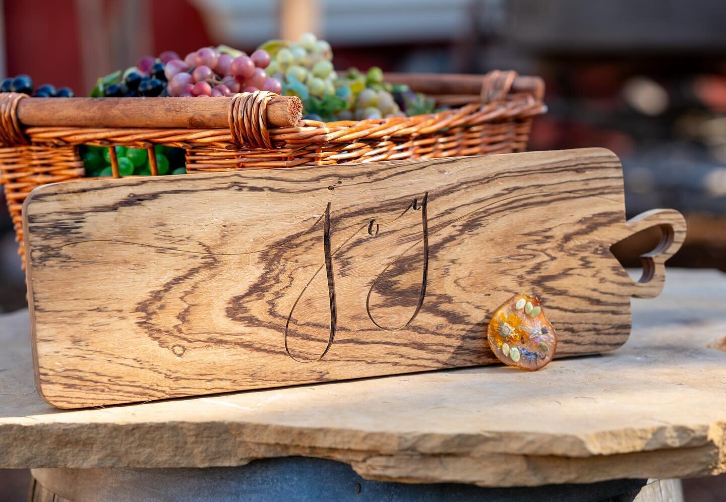 A charming charcuterie board carved with the word &quot;Joy&quot; to spread cheer with every slice and serve! 🎉 This artisanal piece, handcrafted from exquisite zebra wood, is not only a serving board but a reminder of the joyful moments shared arou