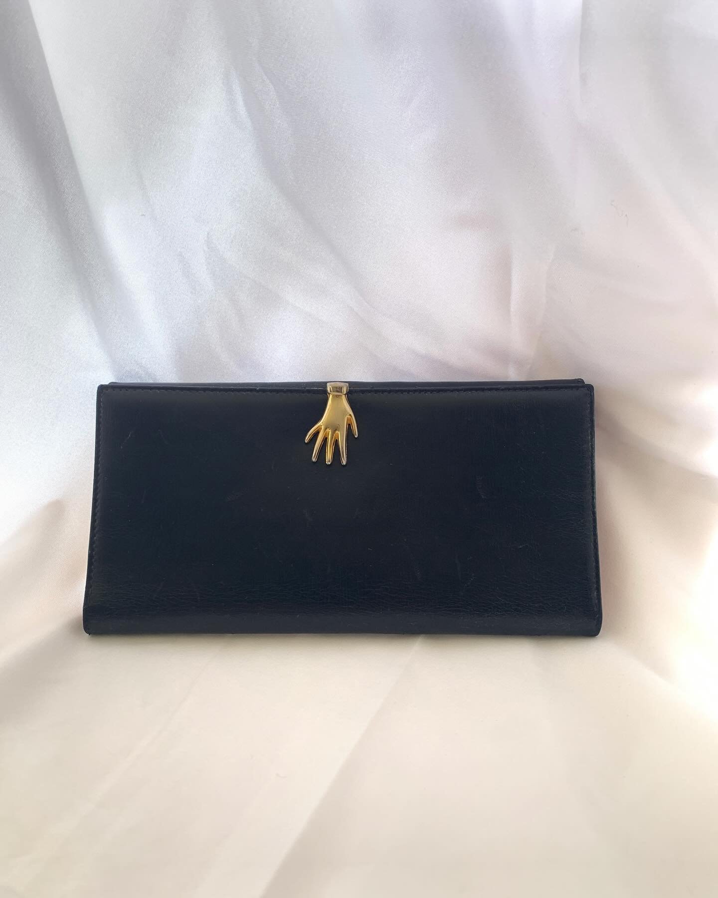 Vintage designer leather wallets made in Italy
&bull;
1970s &ldquo;Hand of Gucci&rdquo; Gucci hand clasp wallet
&bull;
1977 Gucci Wallet in original packaging with receipt
&bull;
1970s Salvatore Ferragamo wallet