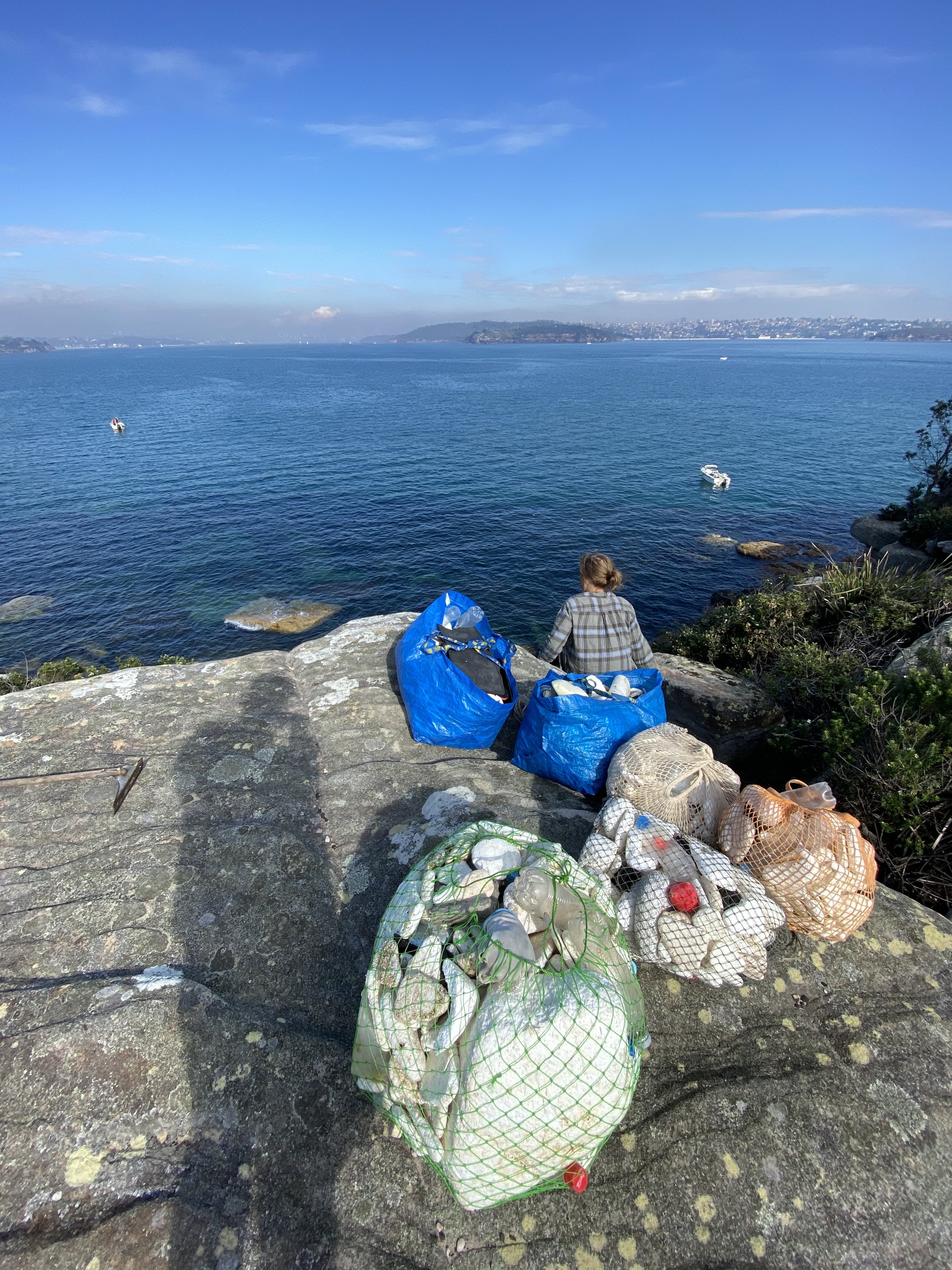 Lucy with bags and city view.jpeg