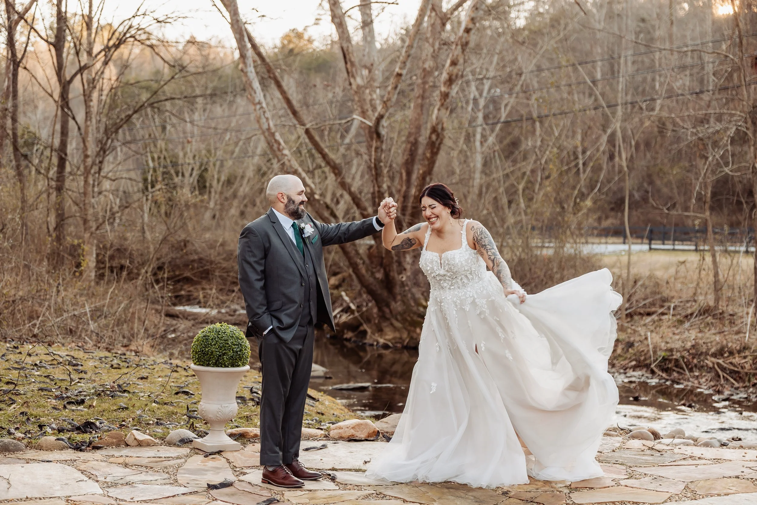 A couple is dancing in the winter for their wedding photos.