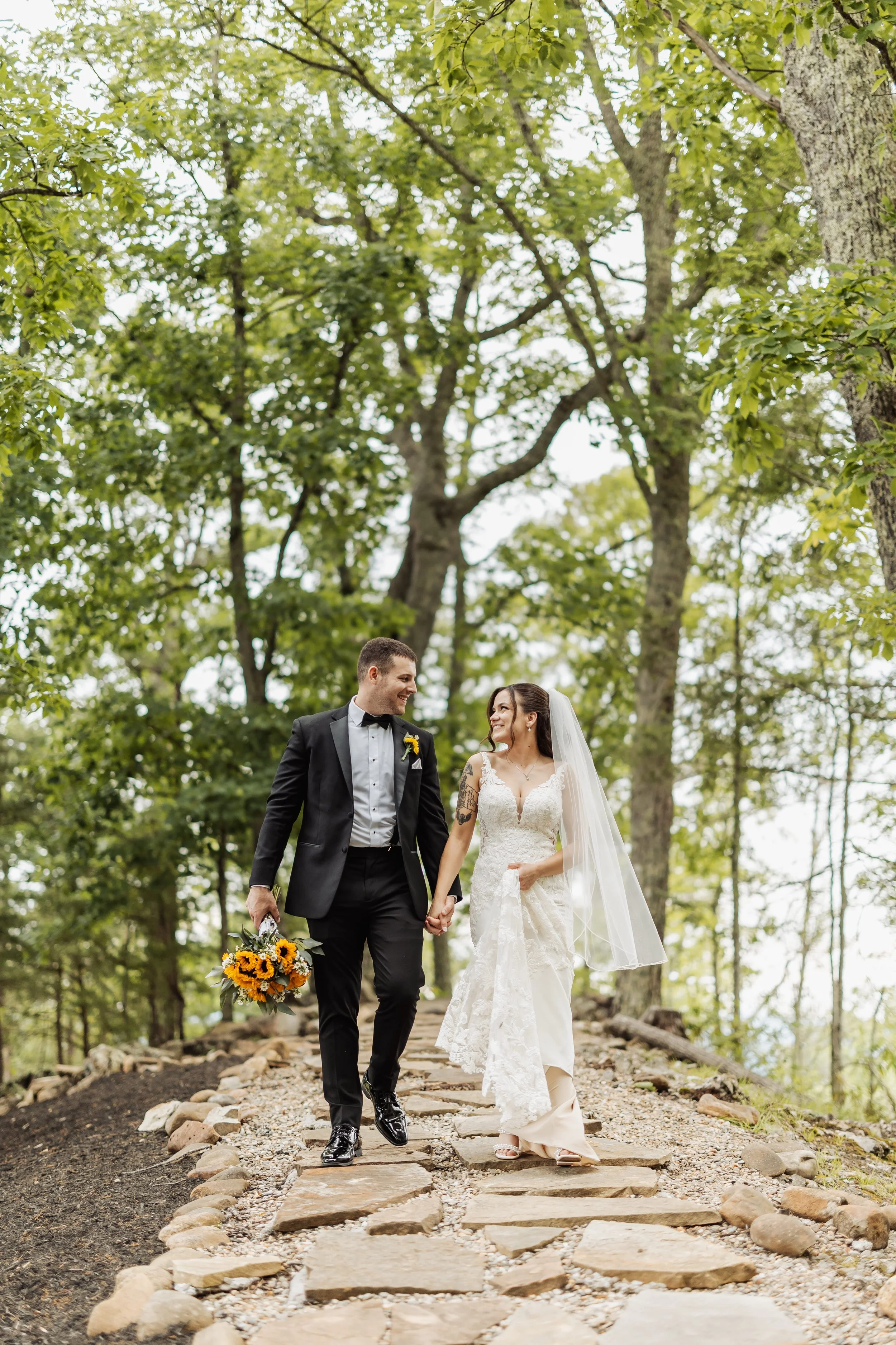 The Magnolia forest path shows the couple walking along it for a photo.