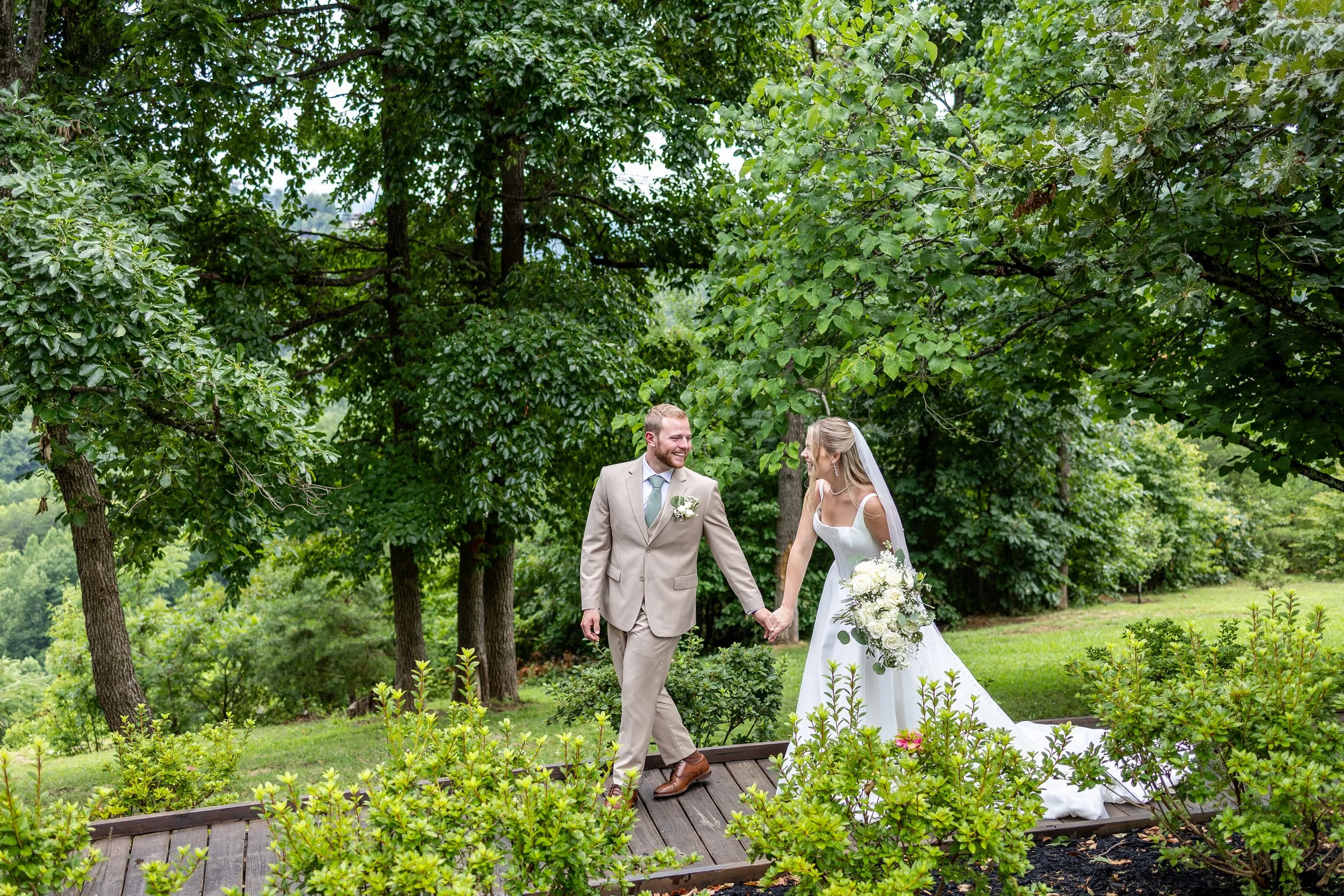 A couple walks through the forest at Cielito Lindo.