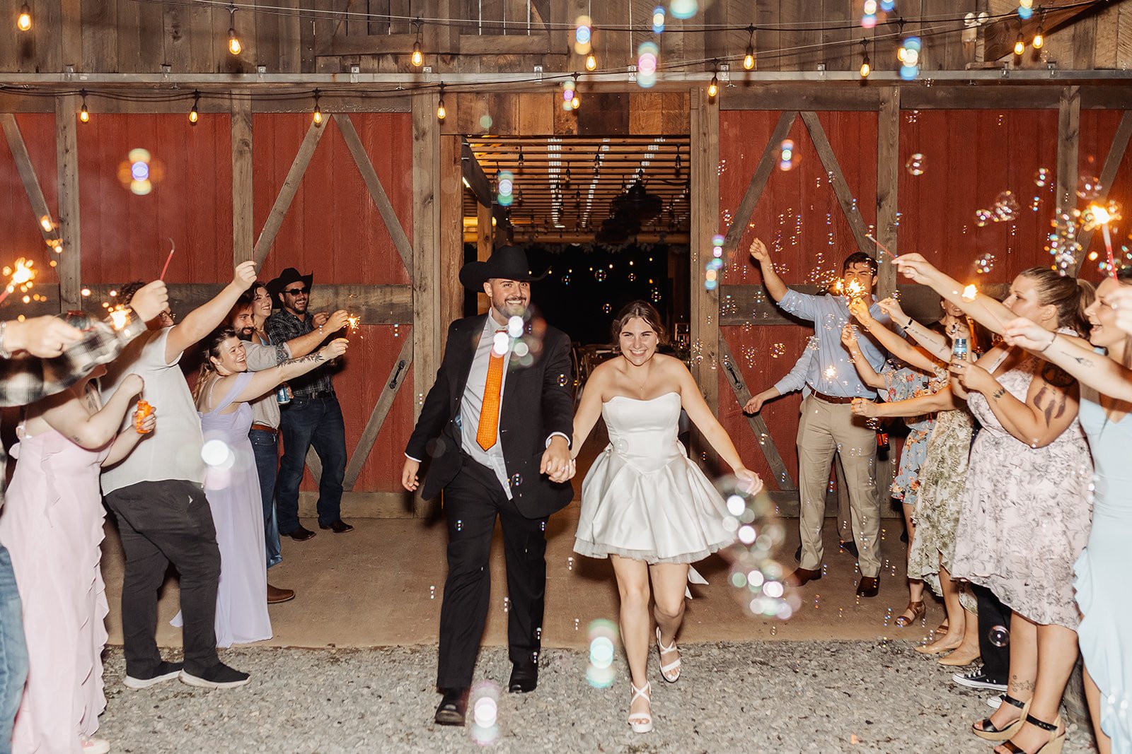 The newlyweds leave the wedding by going through a bubble exit.