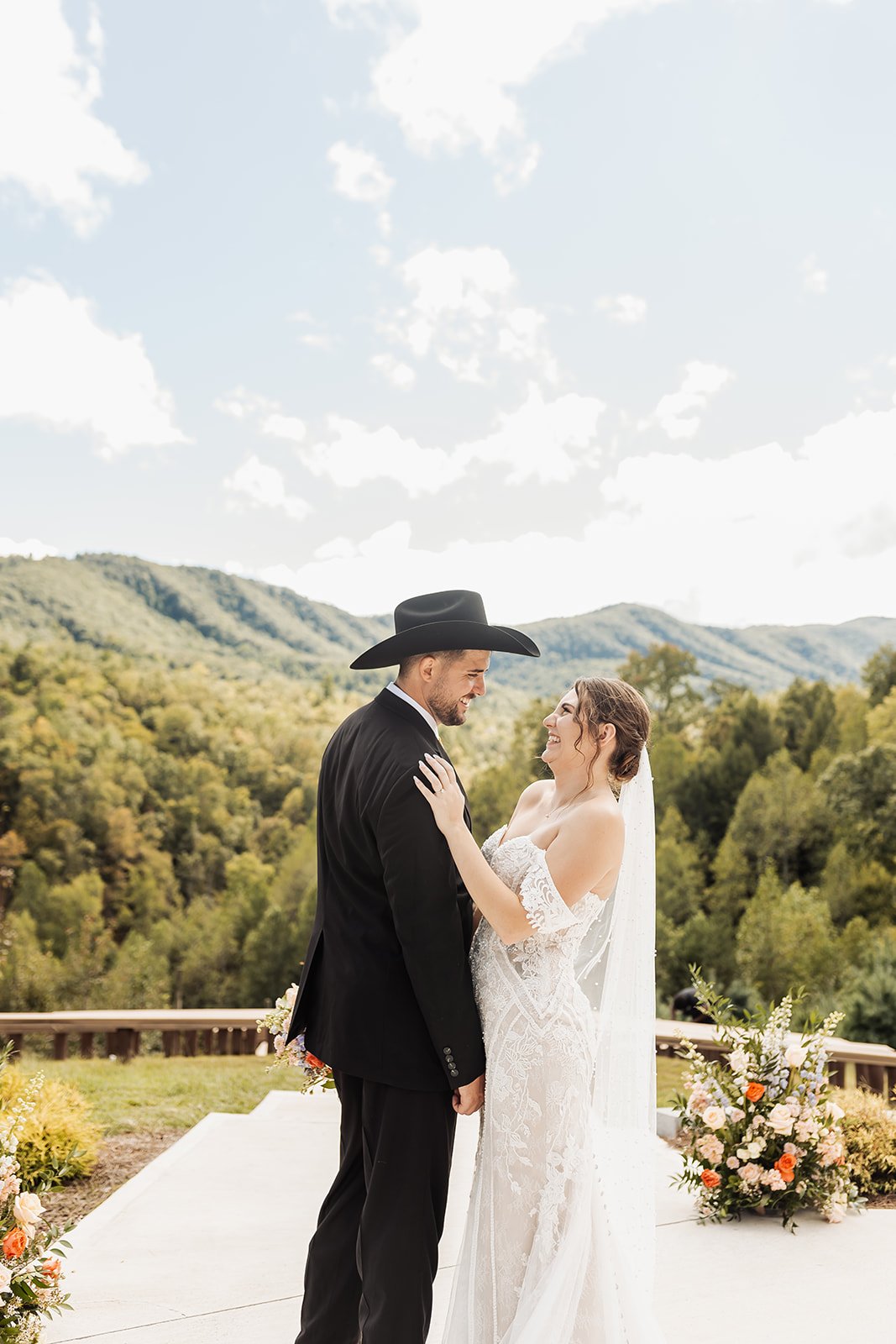 As a Knoxville Wedding Photography, we capture moments like this couple standing and laughing with the Smokies in the backdrop.