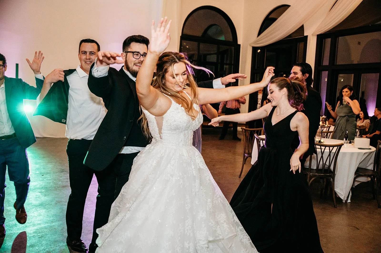 A couple dances, celebrating their wedding.