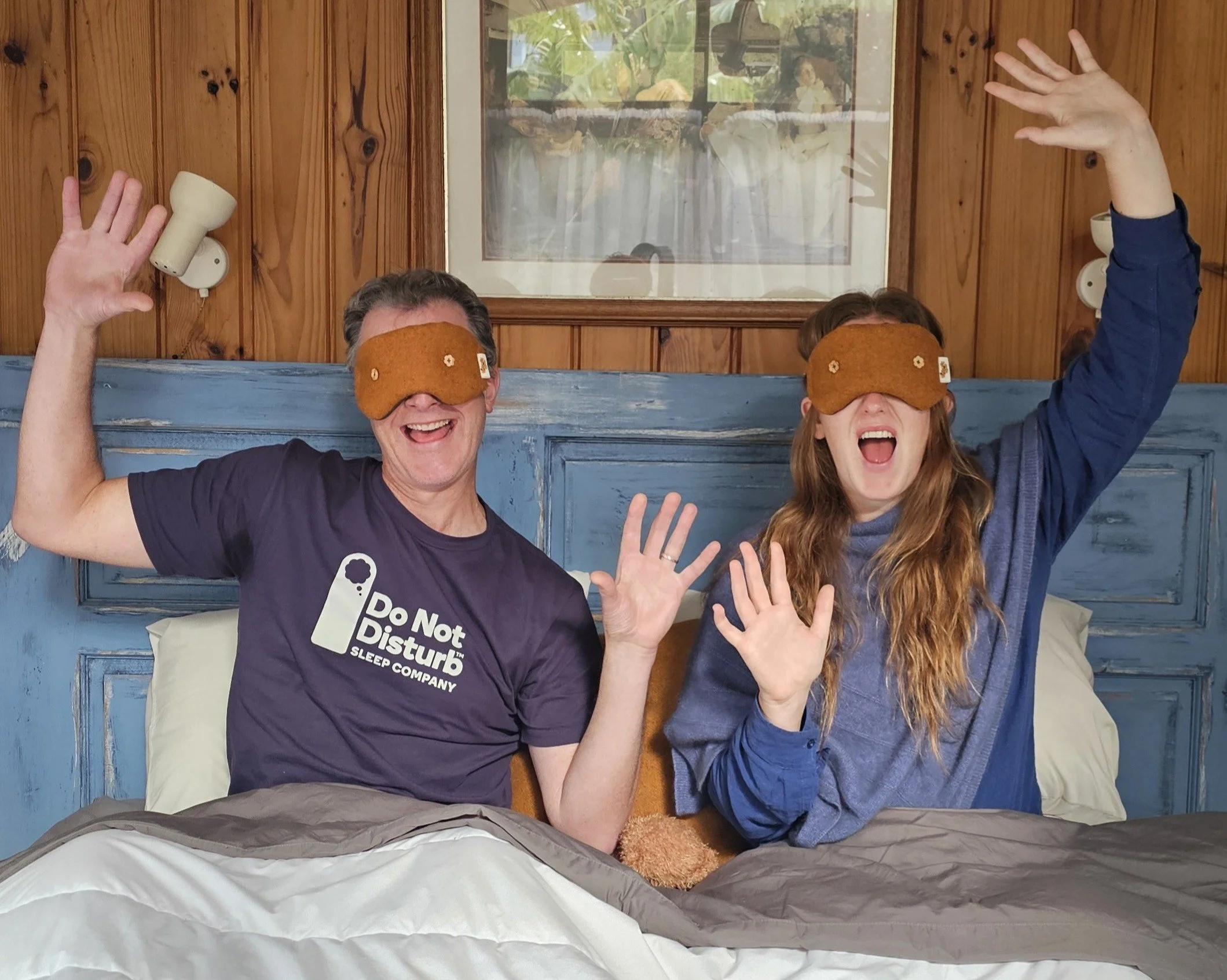 Kate Hall and Do Not Disturb founder Chris Larcombe wearing the limited-edition Orchard Orange weighted eye masks, celebrating the collaboration and shared belief that better sleep is one of the foundations of a healthy, sustainable life.