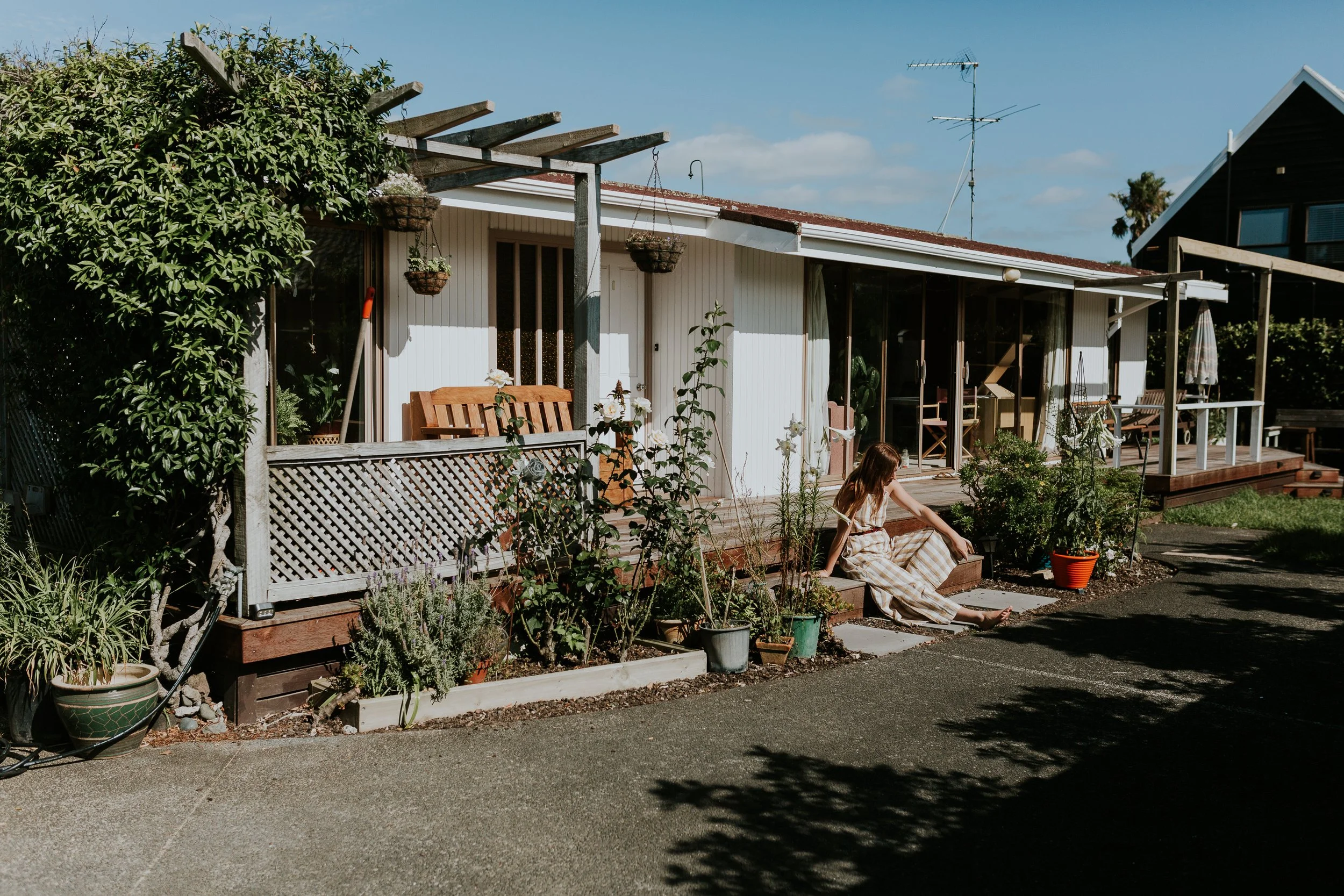 Kate house with kate sitting out the front