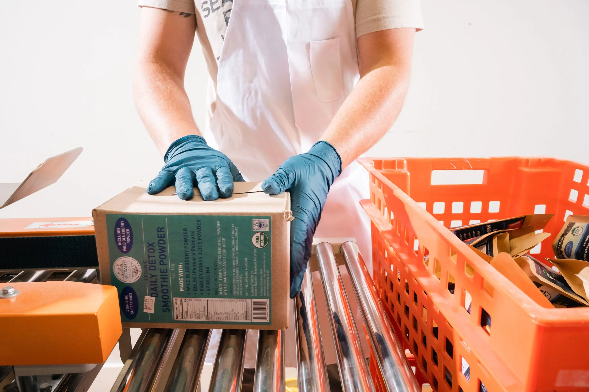 Processor packaging kelp-based products into boxes