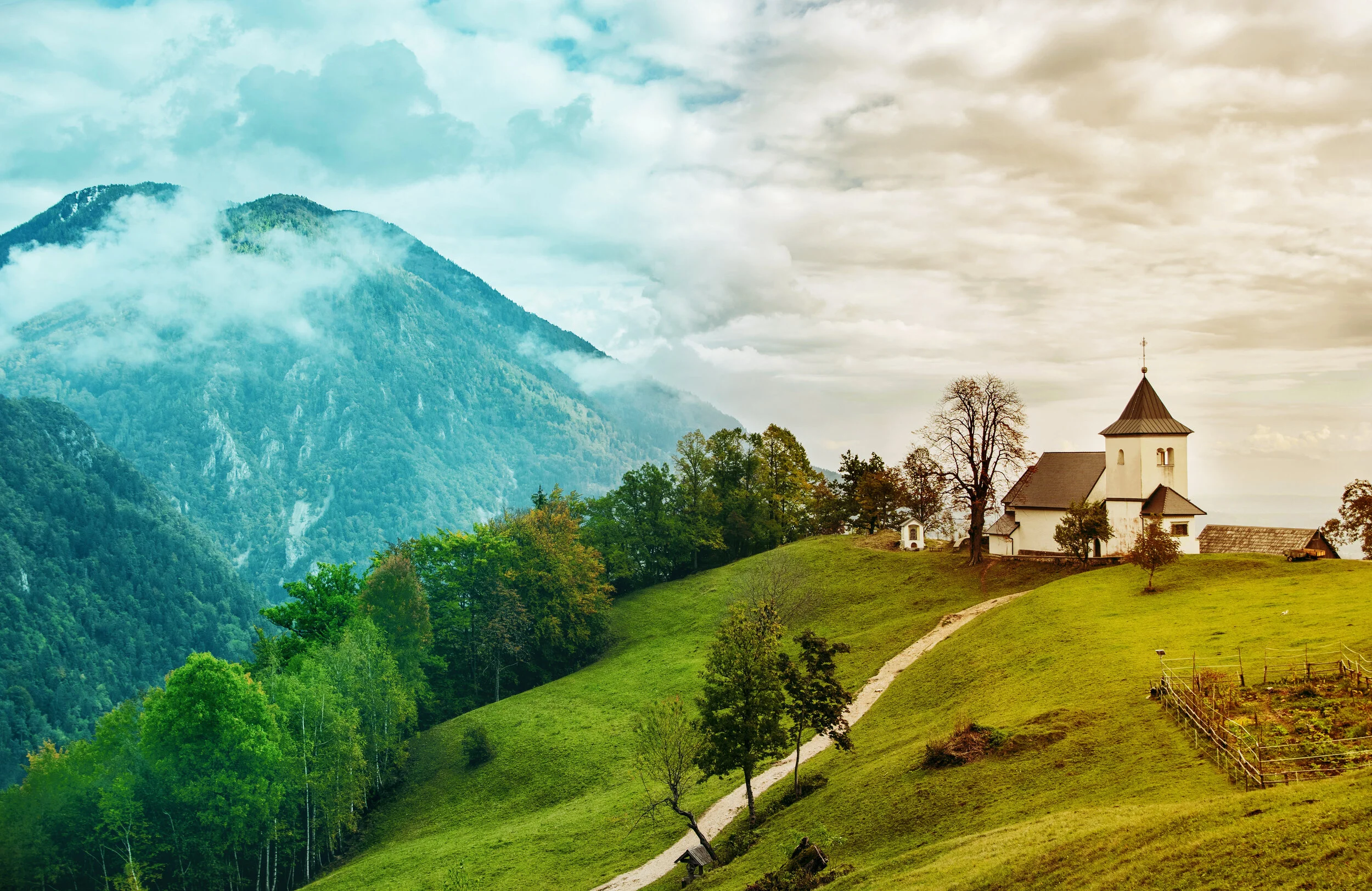 beautiful-nature-with-misty-mountains-and-church-on-top-of-hill-in-begunj-near-radovljica-slovenia_t20_wLGZpK.jpg