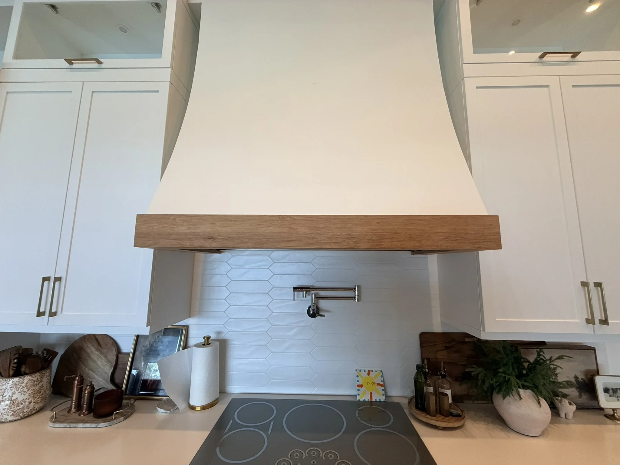 Custom kitchen cabinets and handcrafted wood vent hood