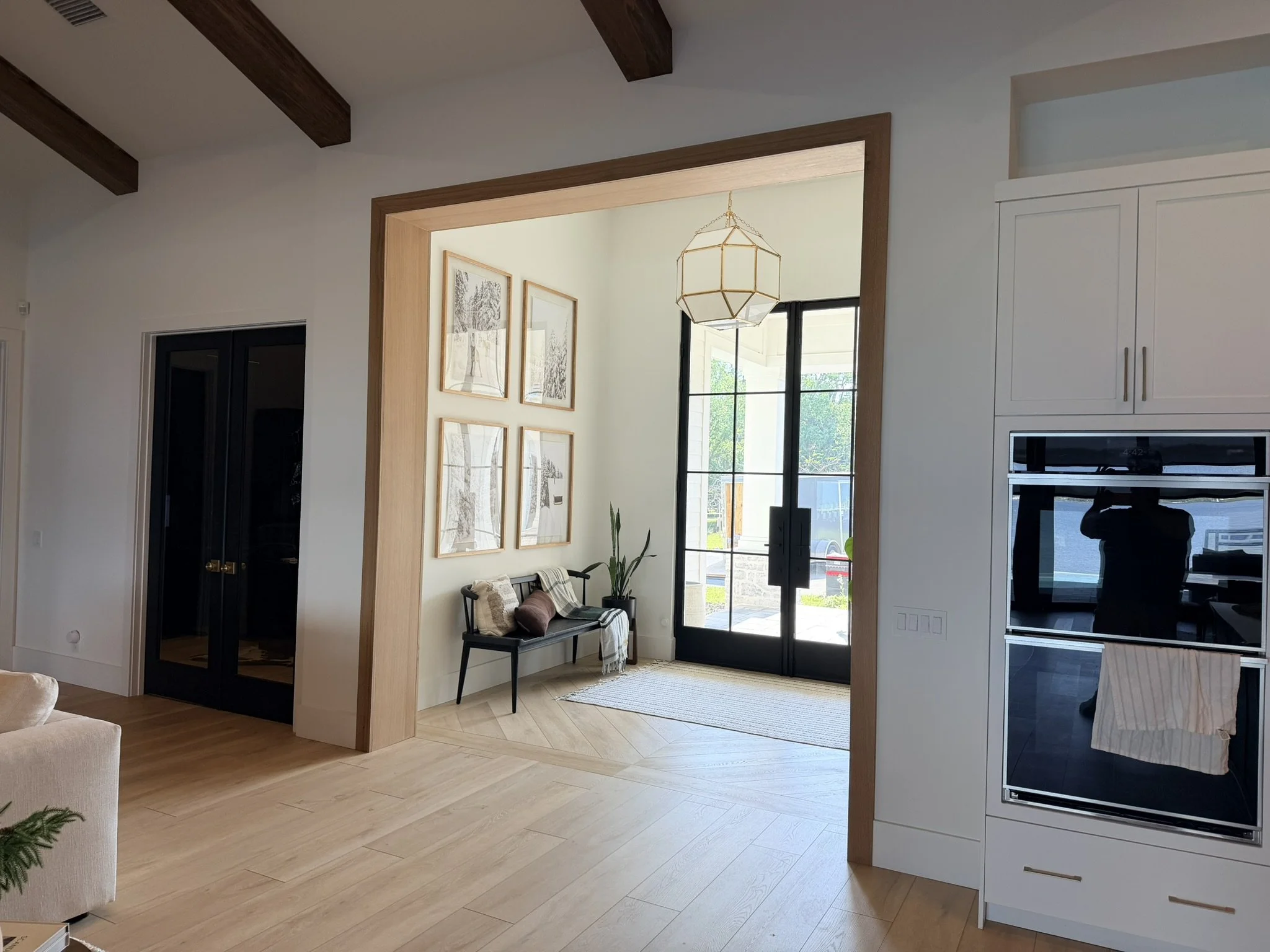 Custom white oak cased opening and luxury interior millwork
