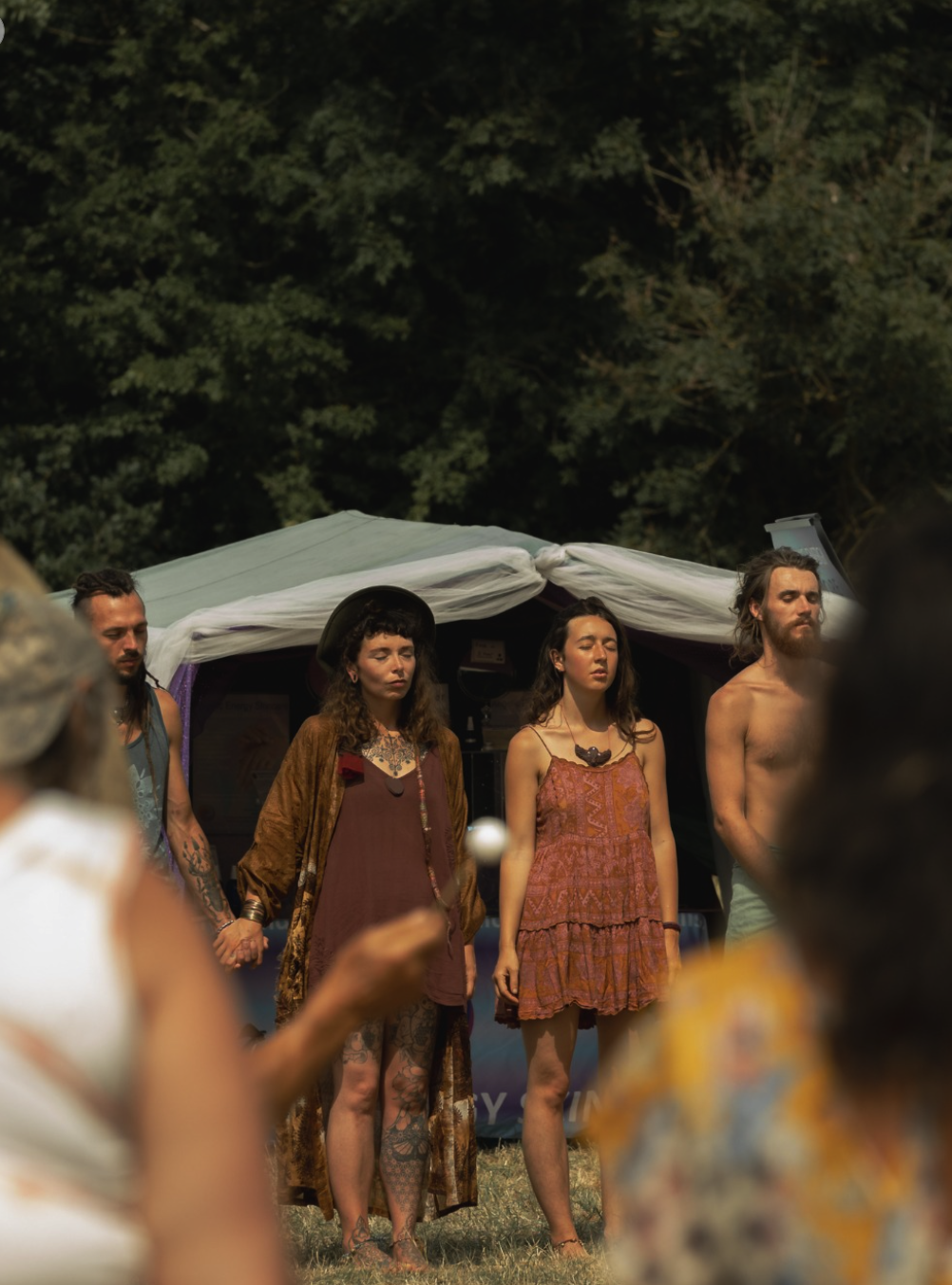 Freezone community holding hands in closing circle