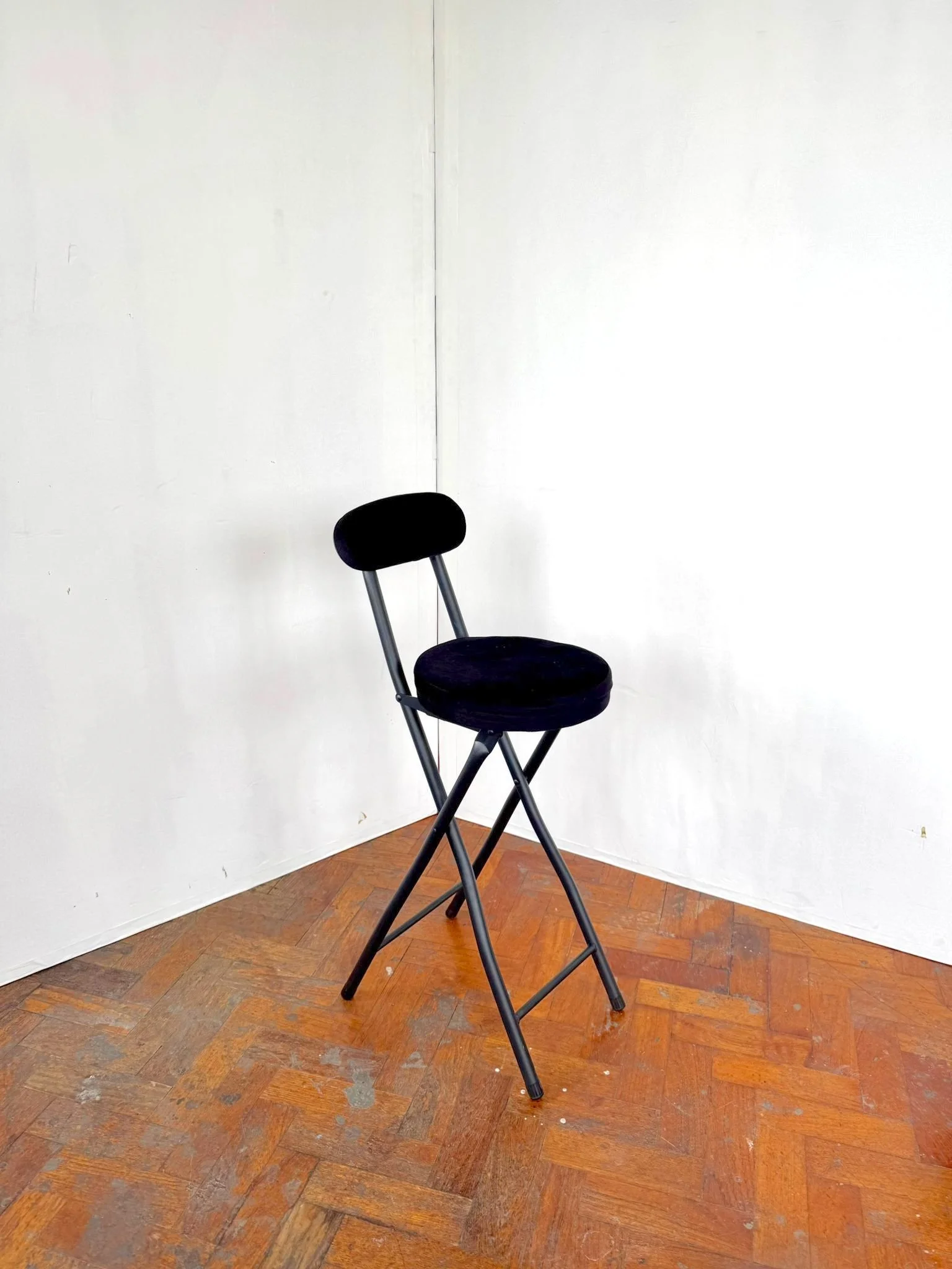 Foldable black stool.jpeg