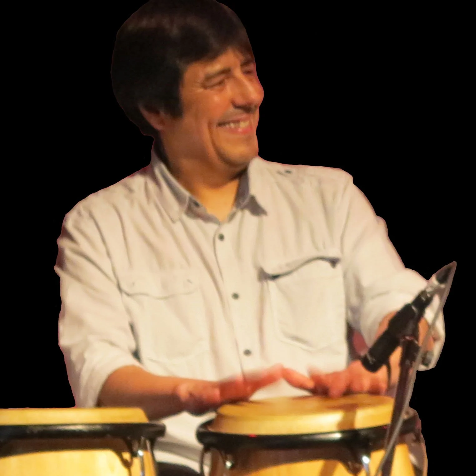 Photo of Carlos Fuentes playing congas