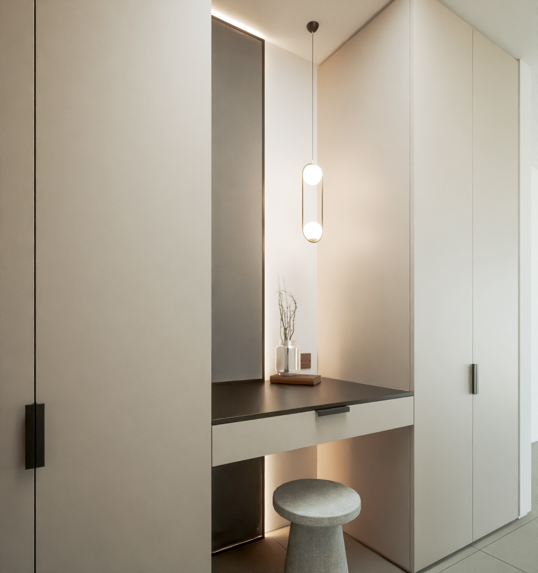 off white spray cabinet doors for the dressing room with a brass pendant handing over a centrally placed vanity unit with black worktop