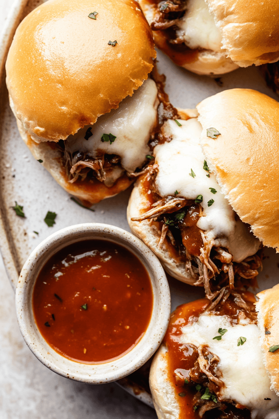 Cheesy Salsa Roja Shredded Beef Sliders
