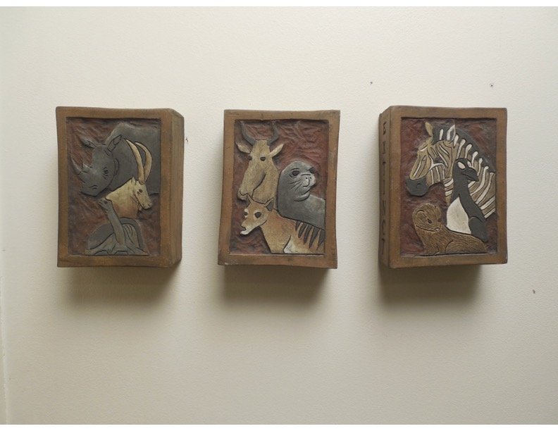 The Passing of Time – Ceramics I, Technique: Slab - Students created a triptych depicting the passing of time on constructed slab tiles, Student depicted animals at different stages of becoming extinct.