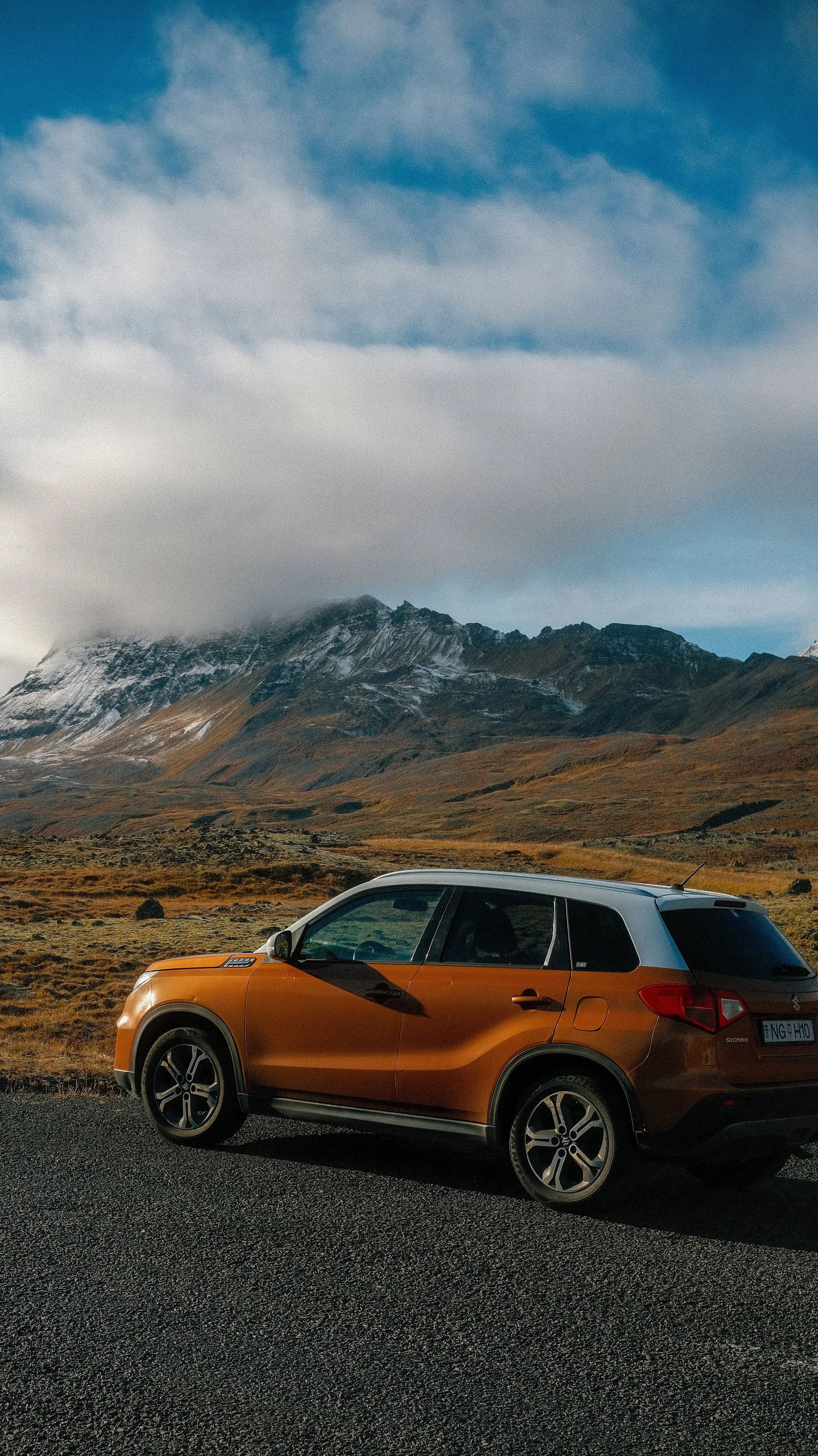 Car detail photography in Iceland with mountain in background