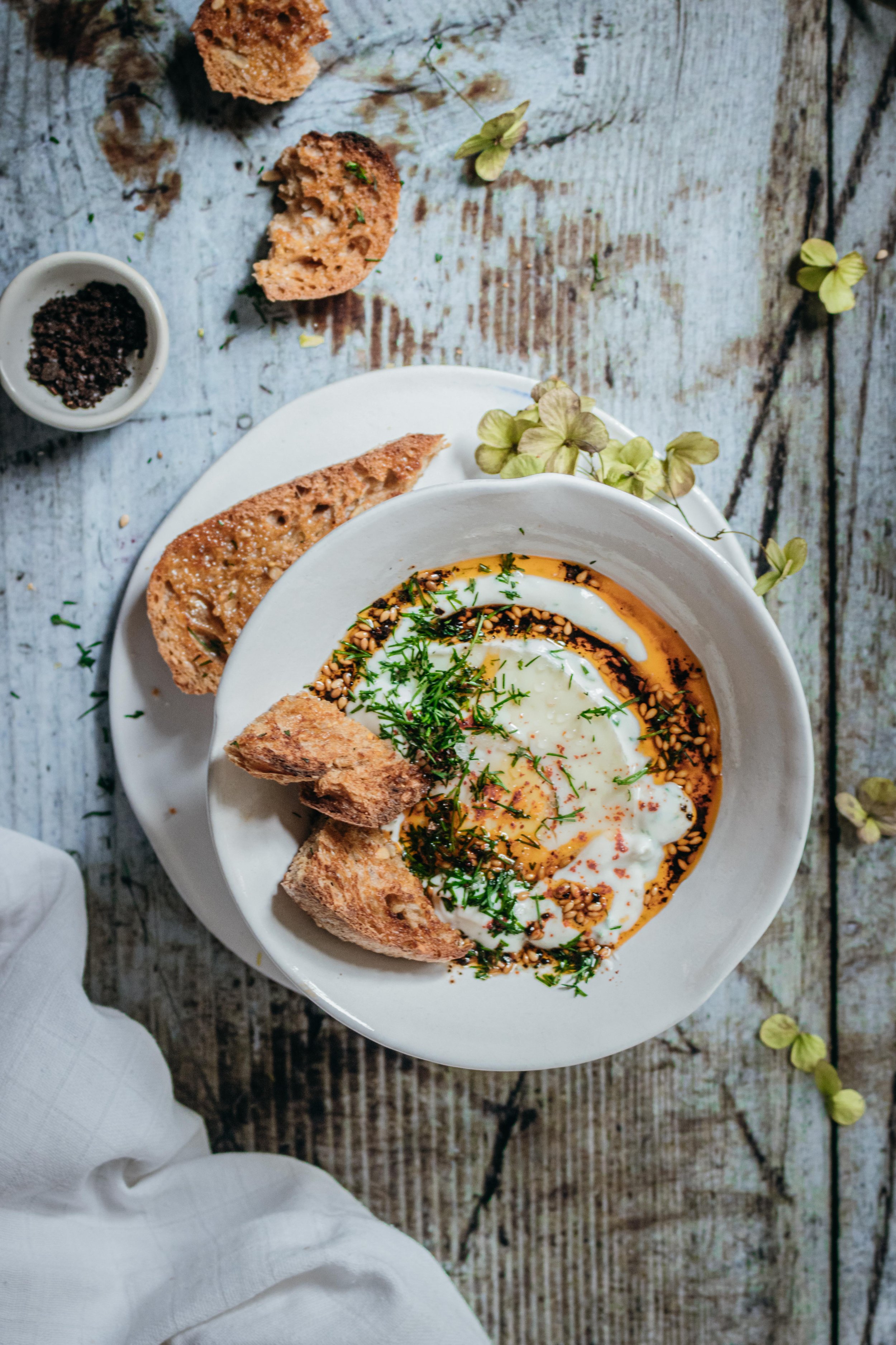 Herby Yogurt Turkish Eggs with Smoked Sesame Chilli Olive Oil