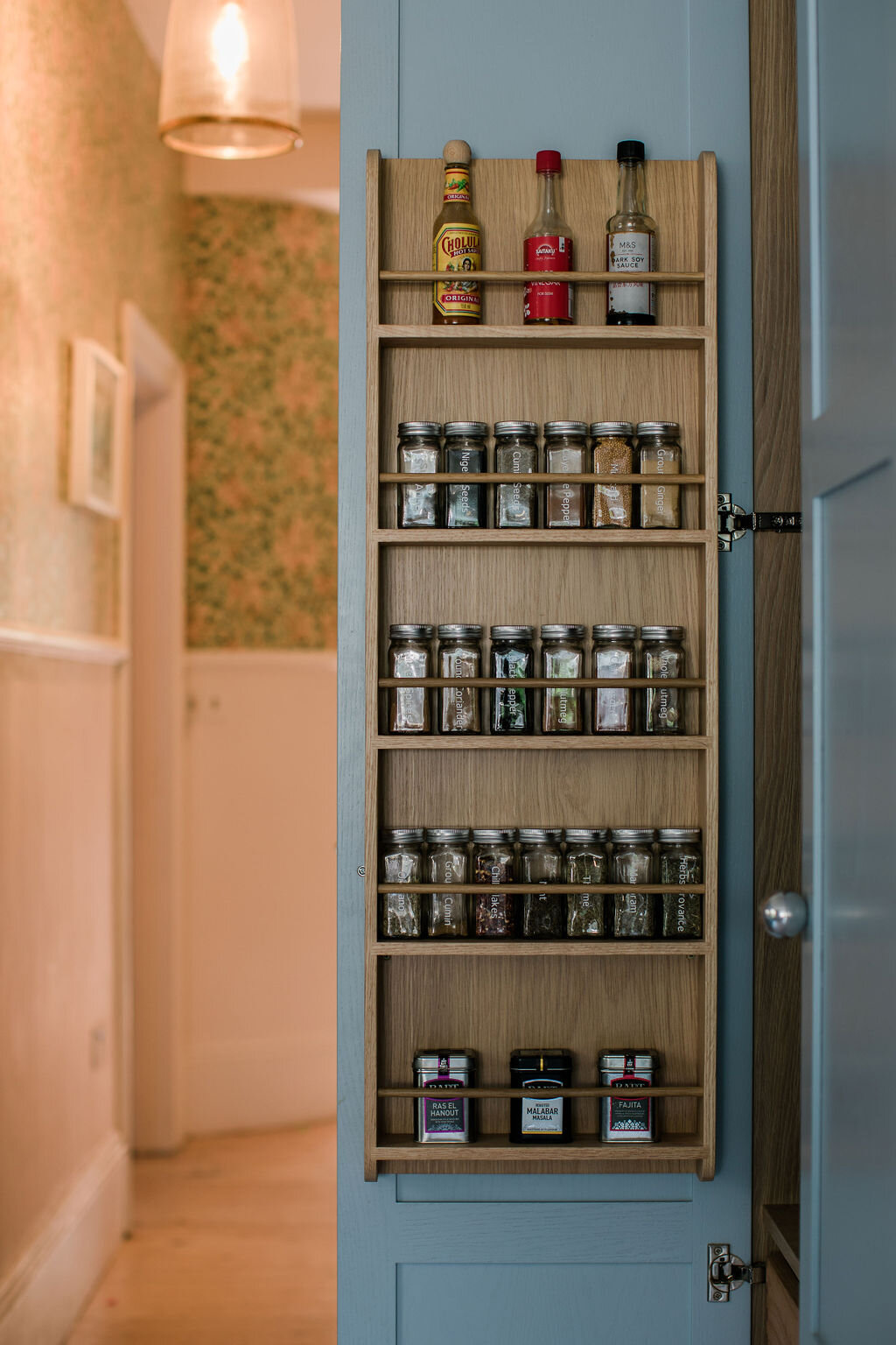 Pantry cabinet with organised labelled spice jars (Copy) (Copy)