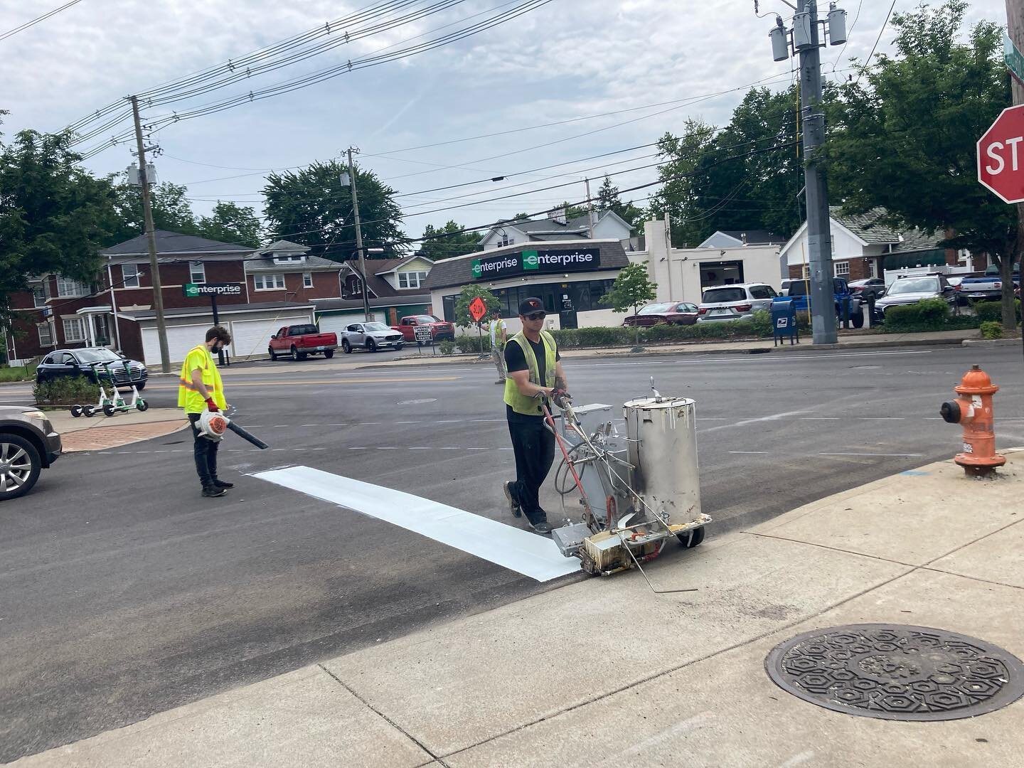 The @kytransportation crew working on the final, critical details of the Bardstown Road redesign - like this crosswalk marking at Midland and Bardstown Road.