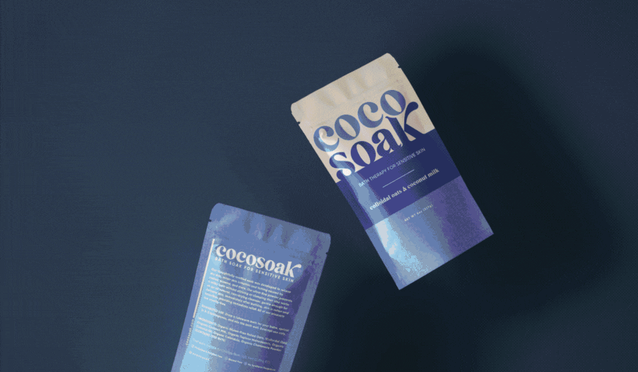 Two sachets of cocosoak, a cooling after-sun gel for sensitive skin, on a dark background with a subtle light reflection.