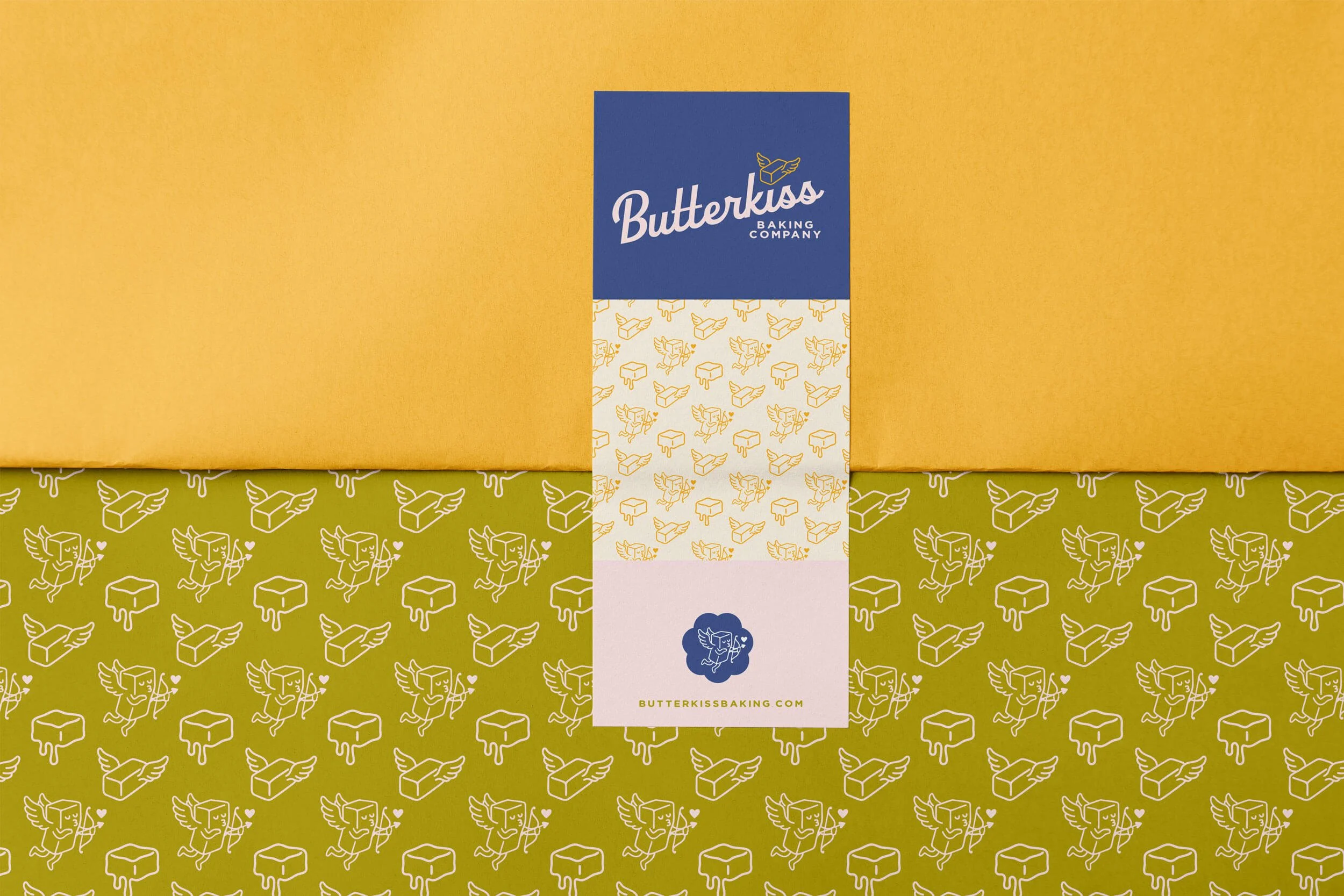 Colorful packaging boxes of Butterkiss Baking Company, design featuring a winged butter logo.