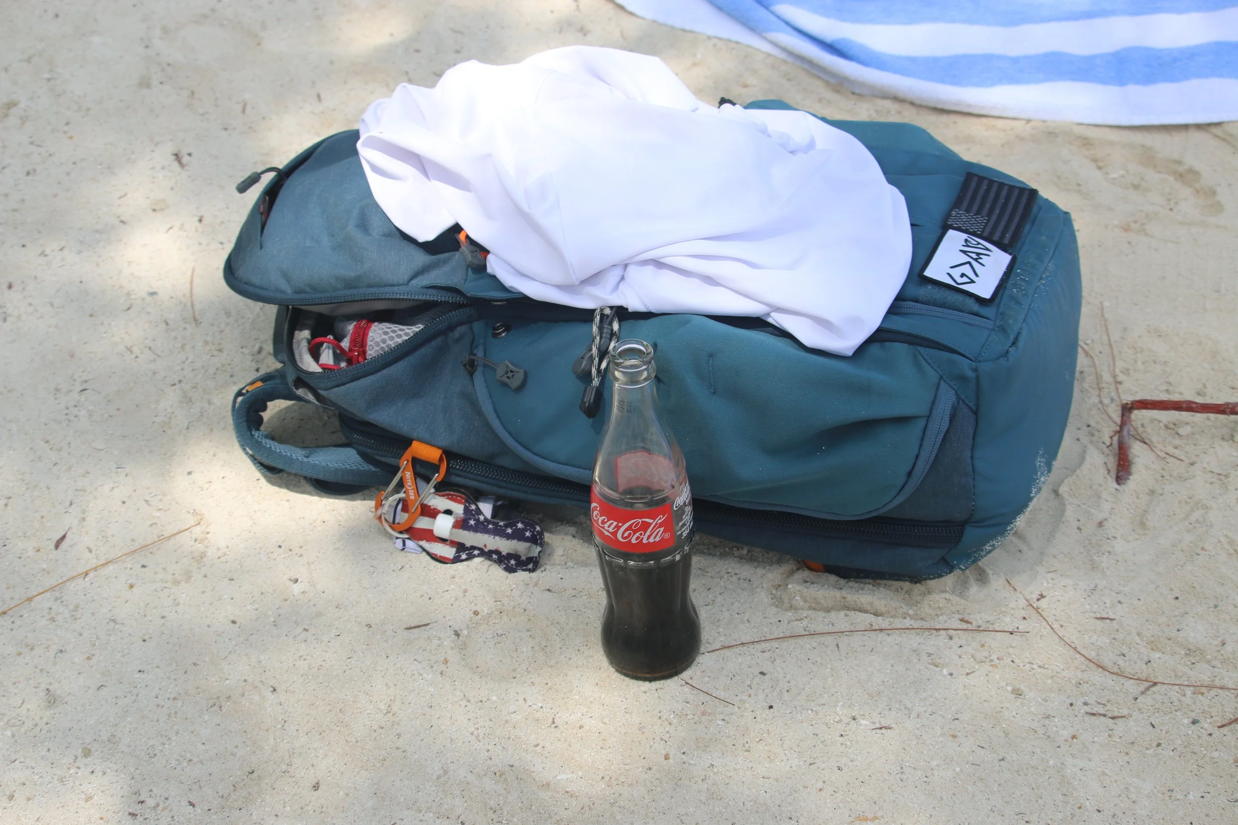 A beach and a Coke and I am happy