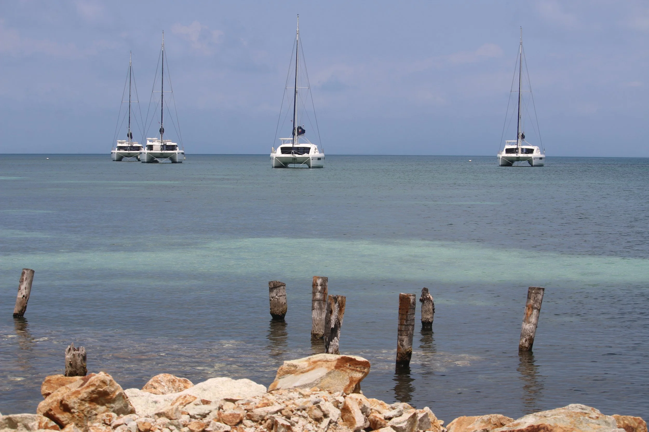 Some of the fleet of catamarans serving as 4 room hotels