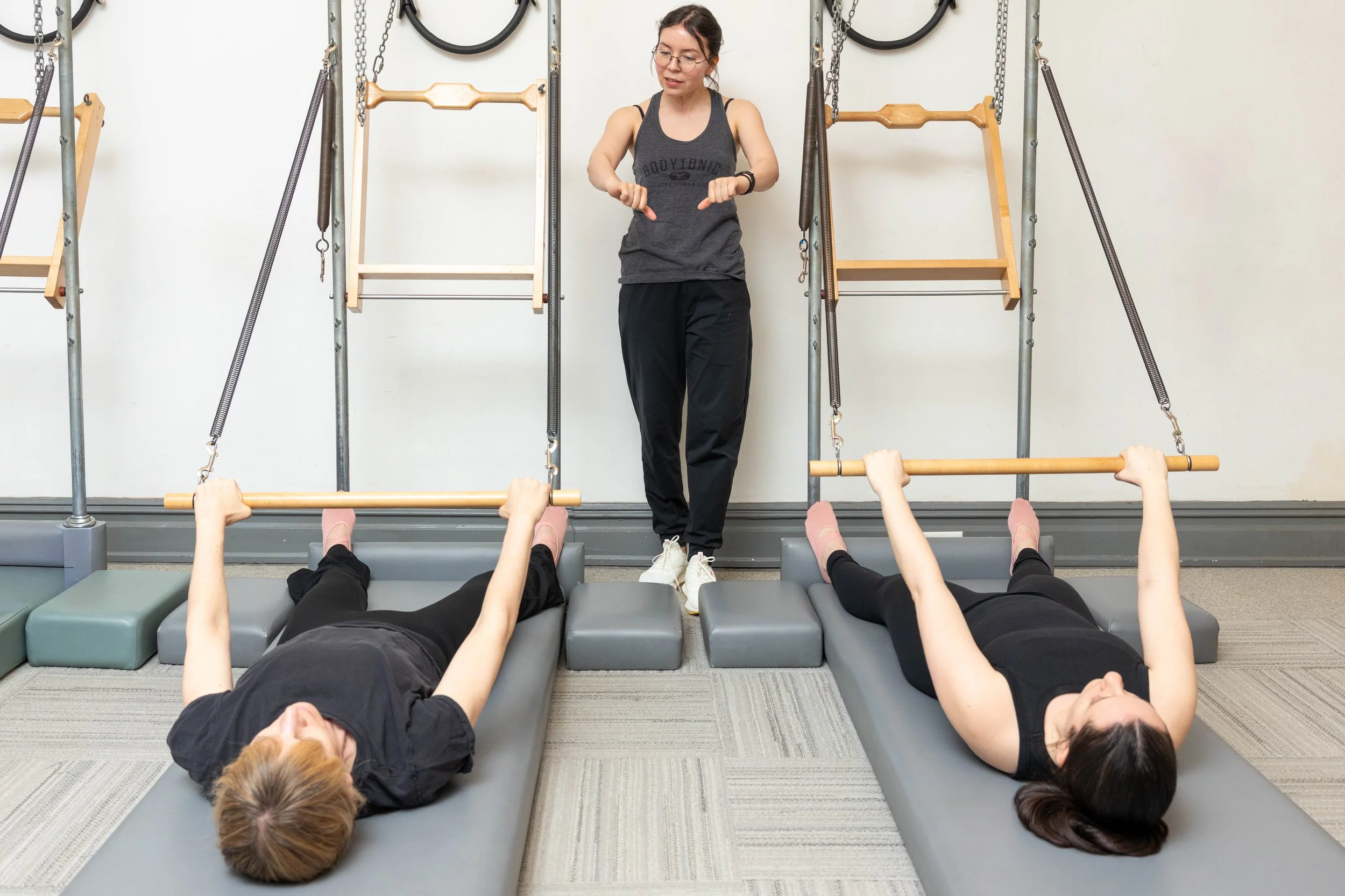 Vanessa teaching a duet with two students on towers.
