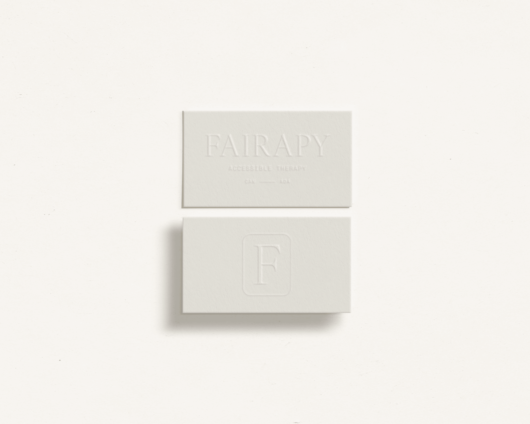 Fairapy business card emboss mock.png