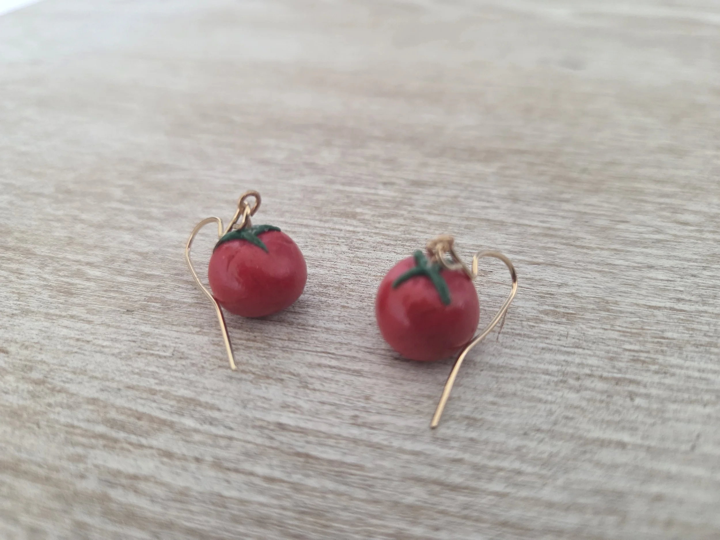 Dangling Tomato Earrings on Desk.jpg