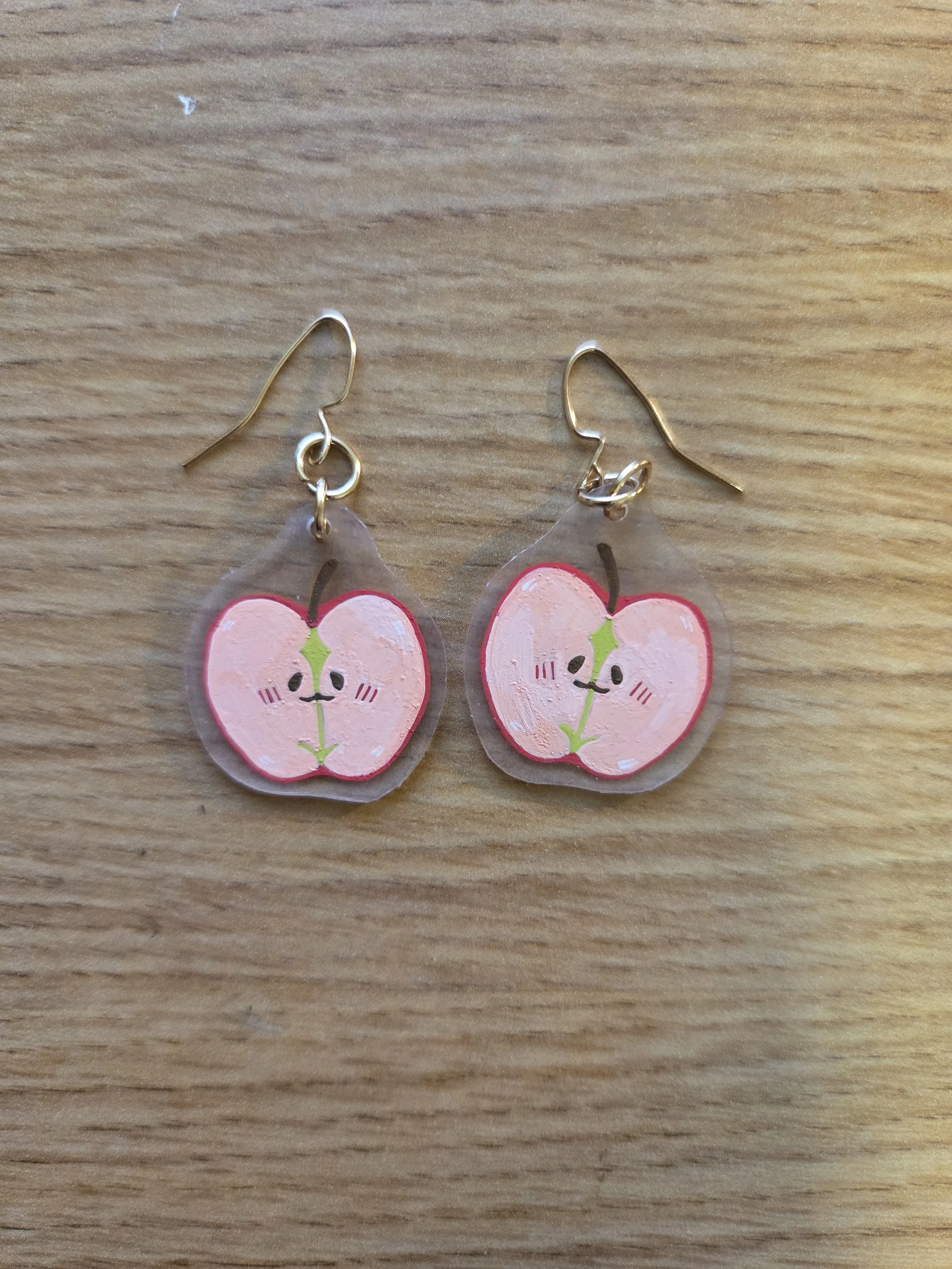 Smiling Apple Earrings on Desk.jpg