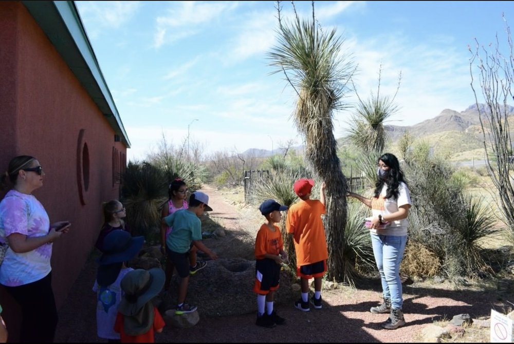 Wendy Diaz teaching the kids about the plants.
