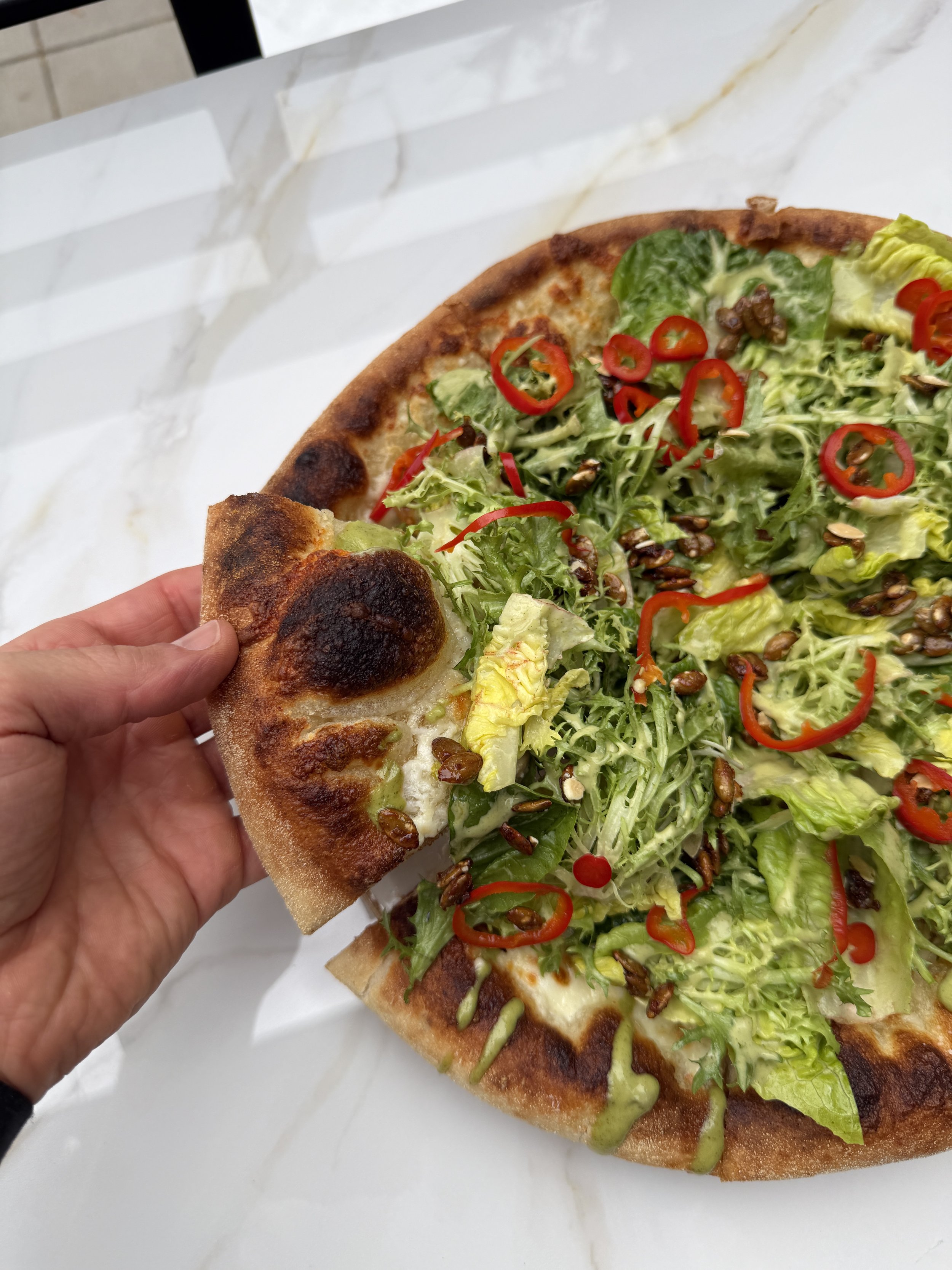 Salad Pizza - Green Tahini Dressing, Roasted Chicken, Pickled Fresno Chilies, Spiced Pepitas