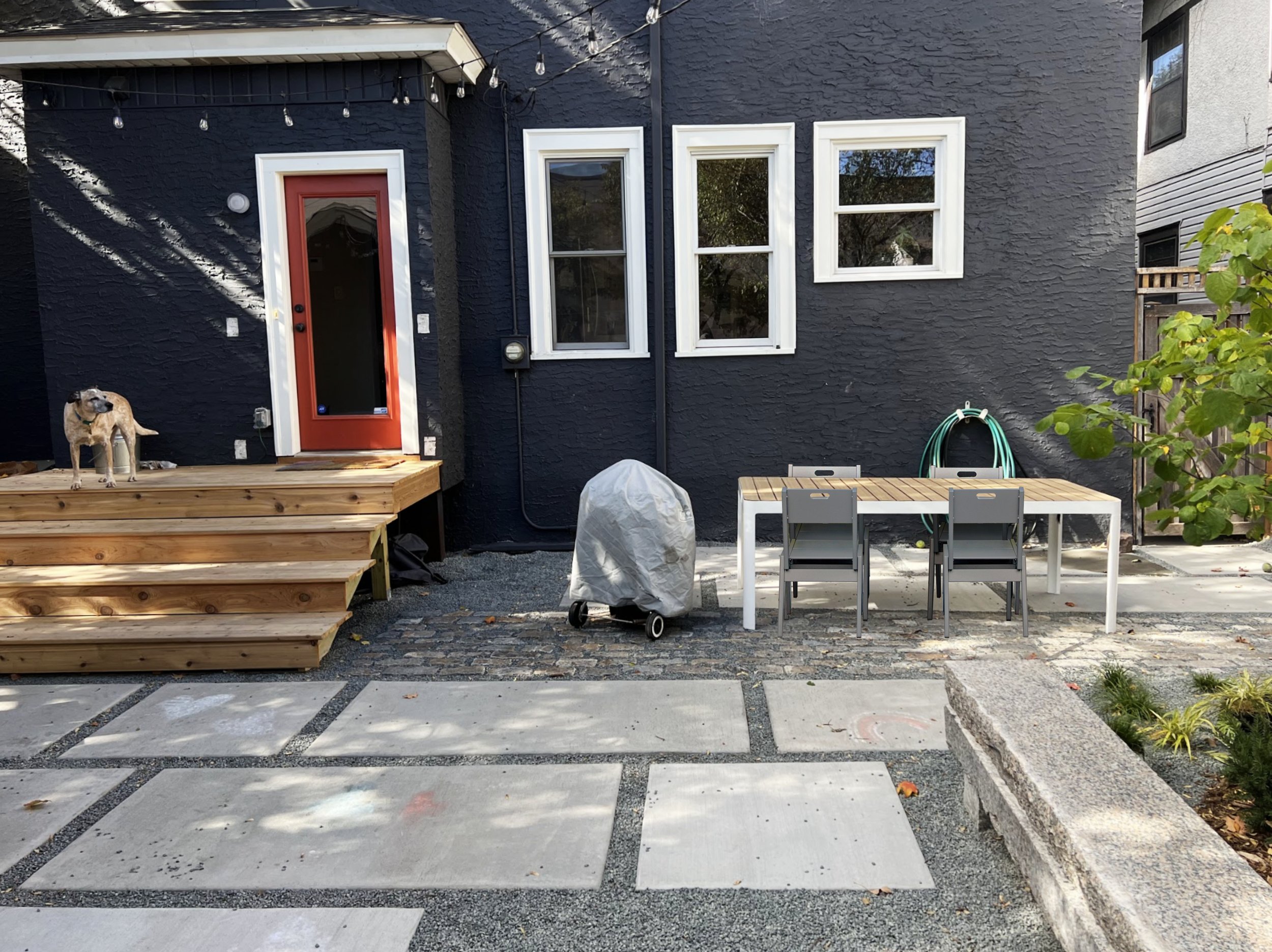 Urban backyard, modern landscape, outdoor dining, concrete slabs, cedar deck, stone bench