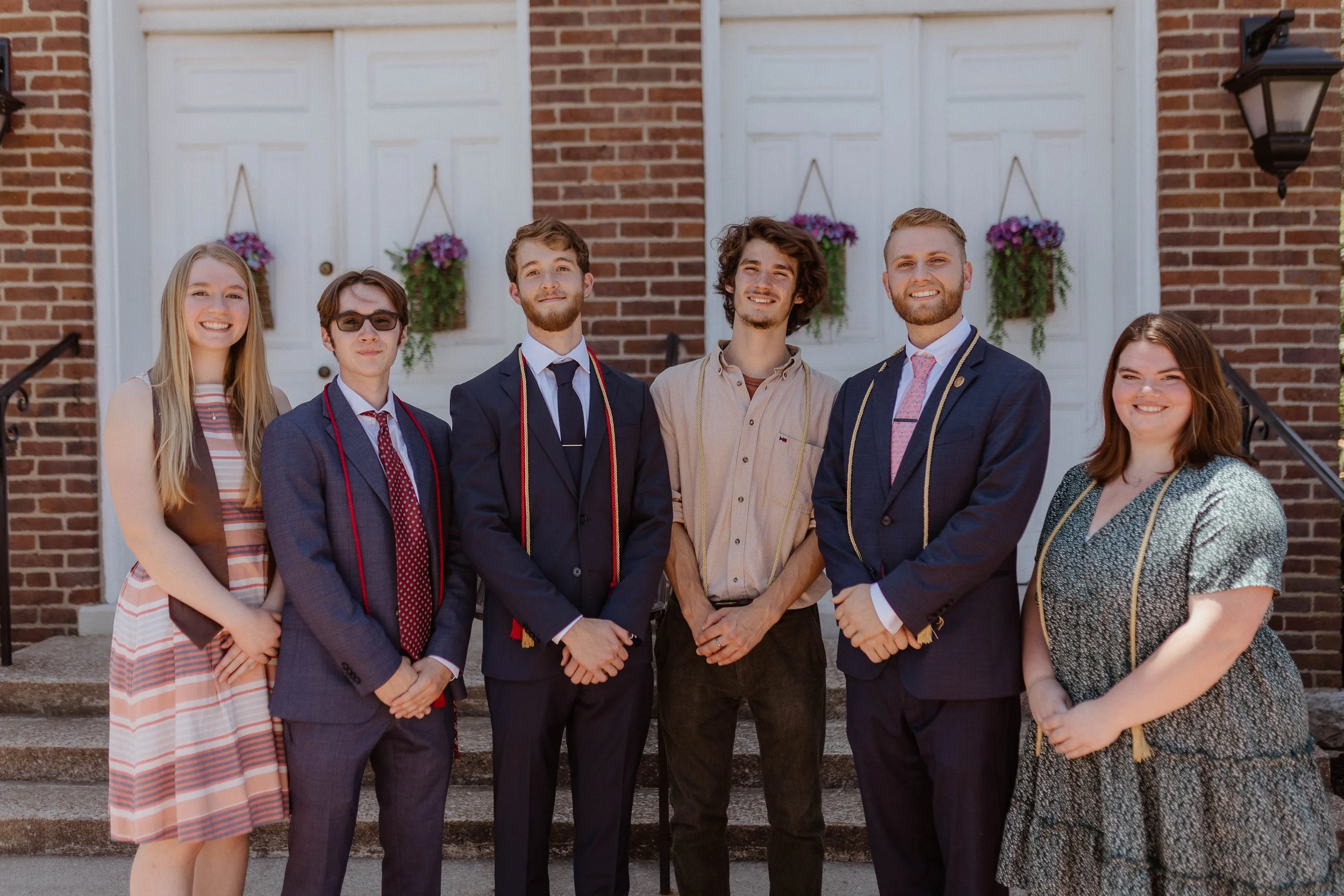 A group of liberal arts students standing outside.
