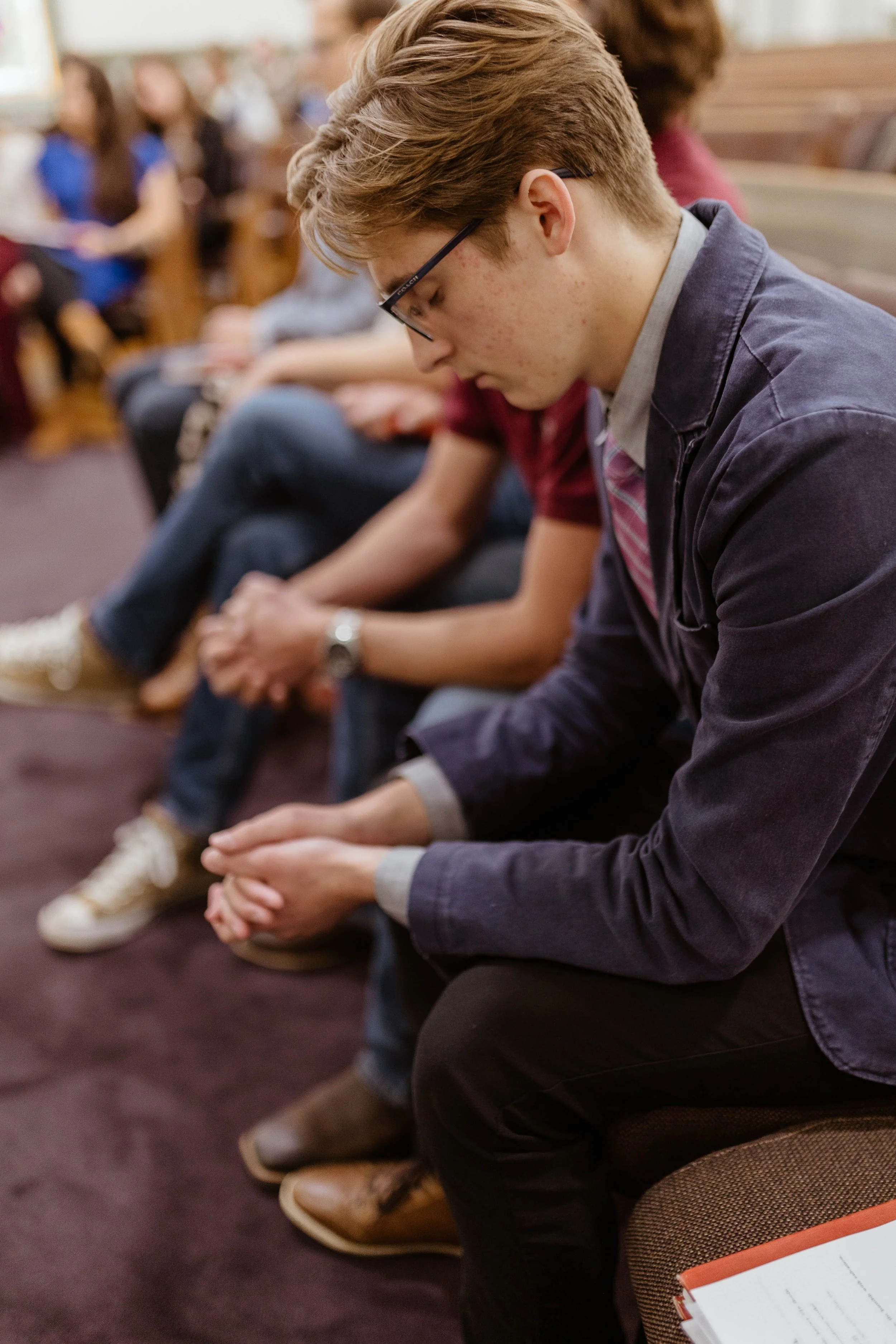 New College Franklin student in daily prayer service in Franklin Tennessee..